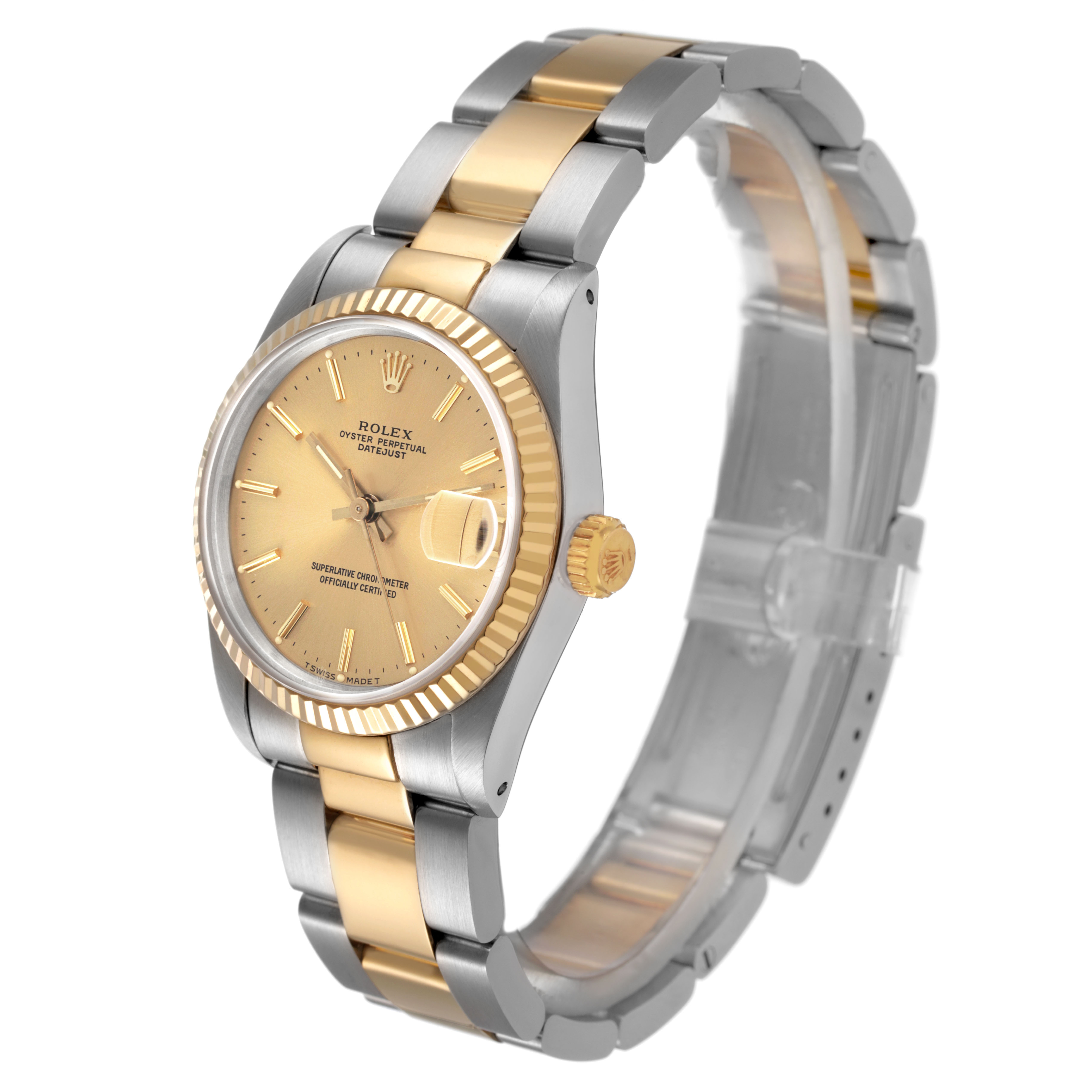 The Rolex Mid-Size 68273 Women's Steel and Gold (two tone) Champagne Dial watch is shown at a slight angle, highlighting its gold and silver bracelet, fluted bezel, and watch face details.