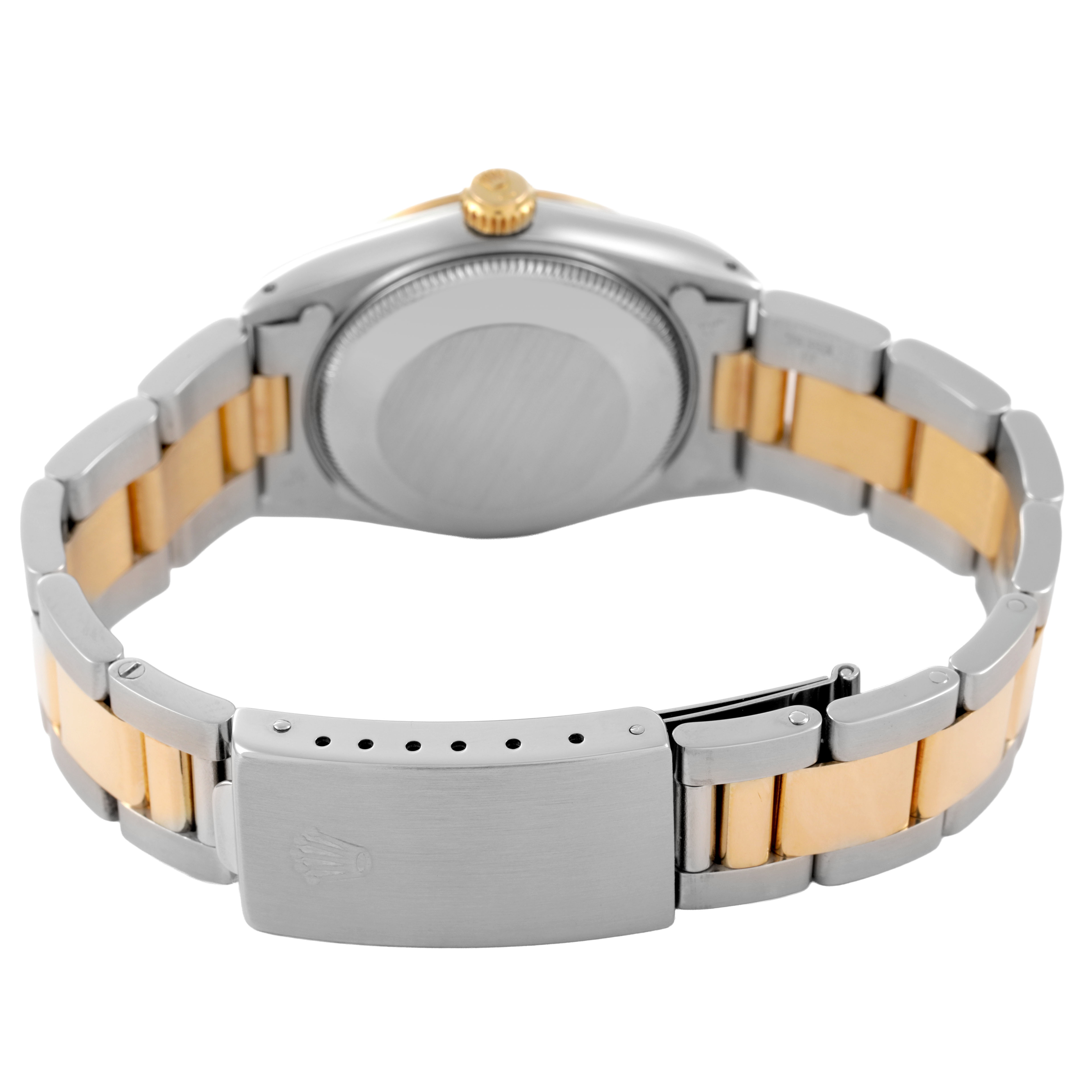 The image shows the back and clasp of a Rolex Mid-Size 68273 Women's Steel and Gold (two tone) Champagne Dial watch, highlighting its two-tone metal bracelet and crown.