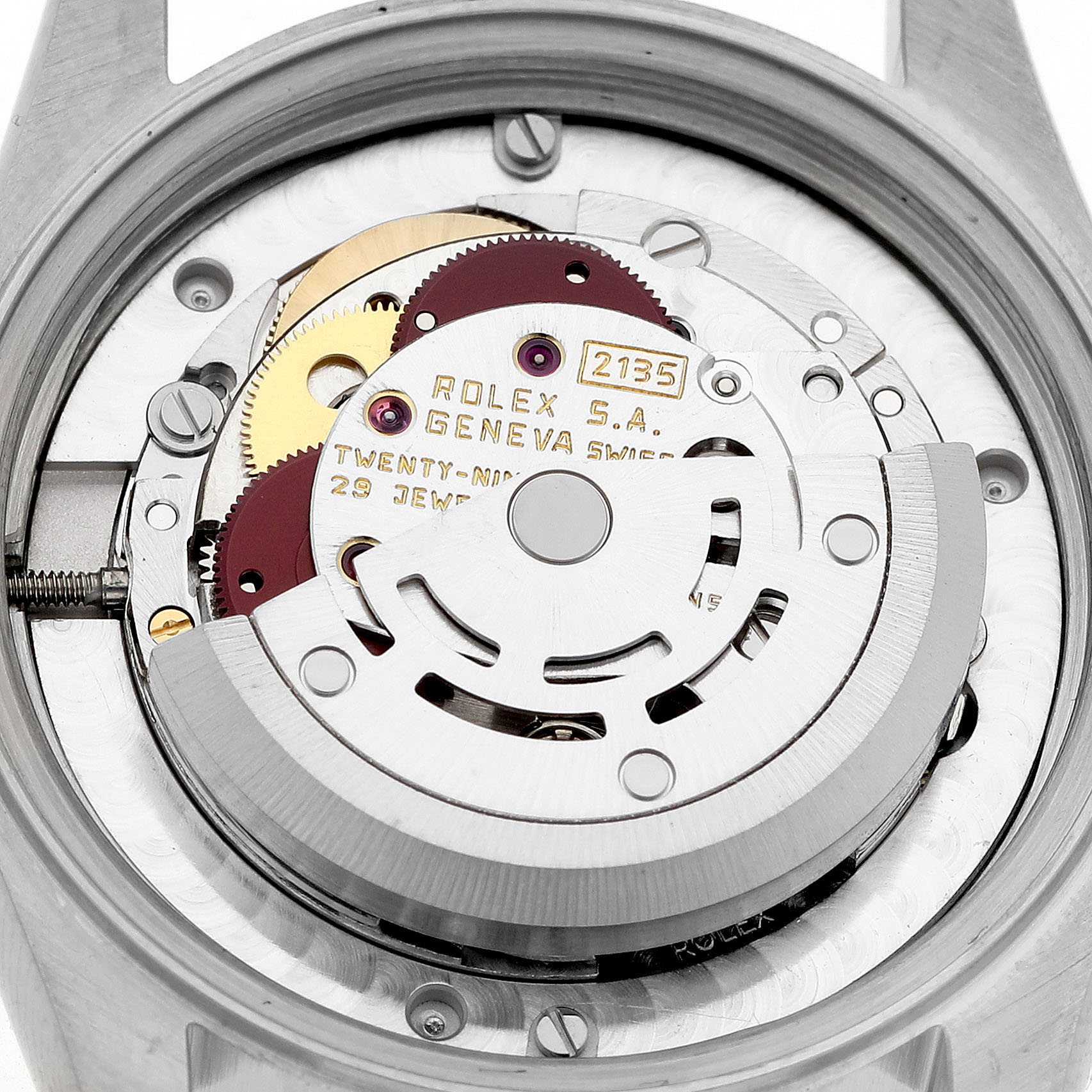 The image shows a close-up of the movement inside a Rolex Mid-Size 68273 Women's Steel and Gold (two tone) Champagne Dial watch, focusing on gears and inscriptions.