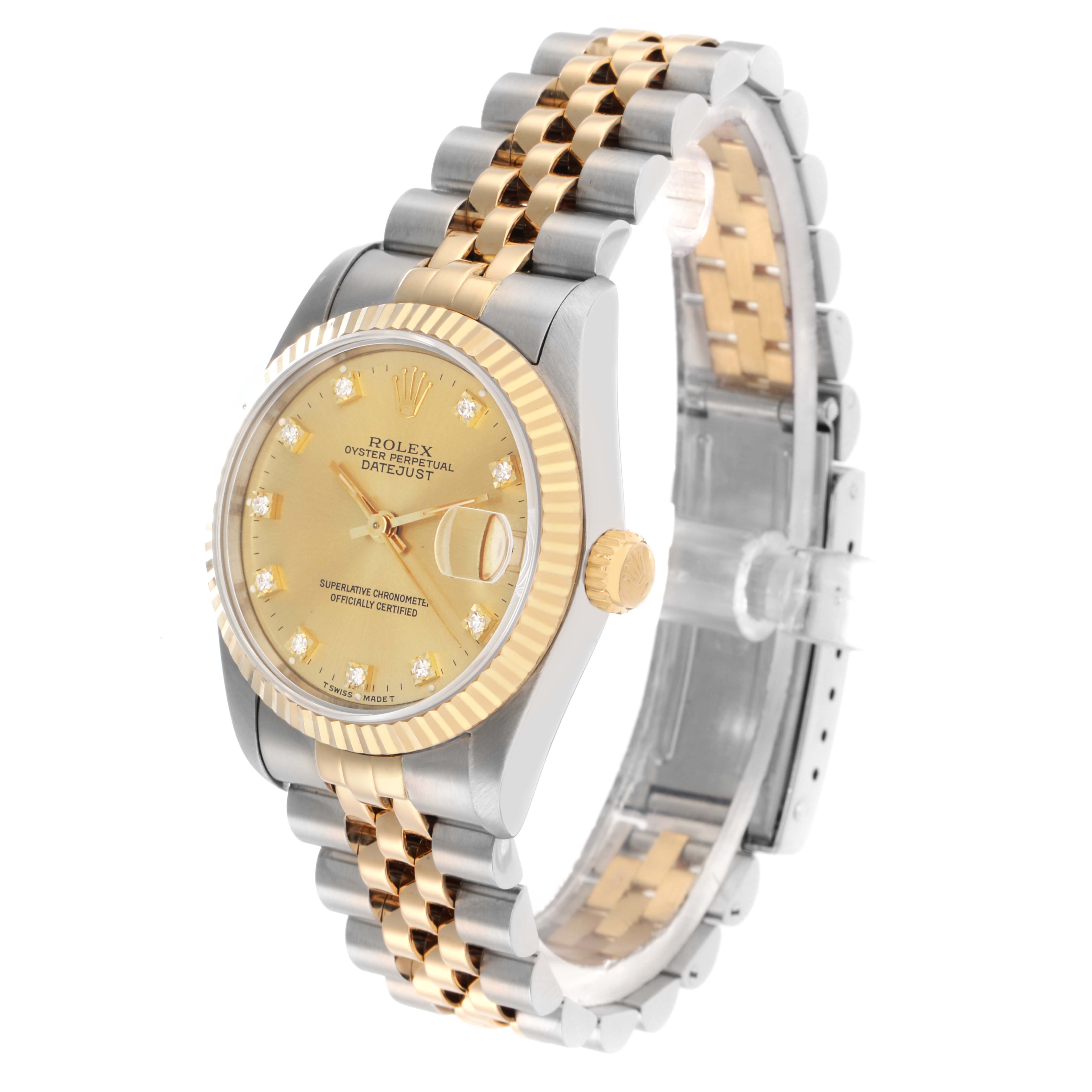 The Rolex Mid-Size 68273 Women's Steel and Gold (two tone) Champagne Dial watch is shown at a slight angle, displaying the gold and silver bracelet, fluted bezel, and diamond-accented dial.