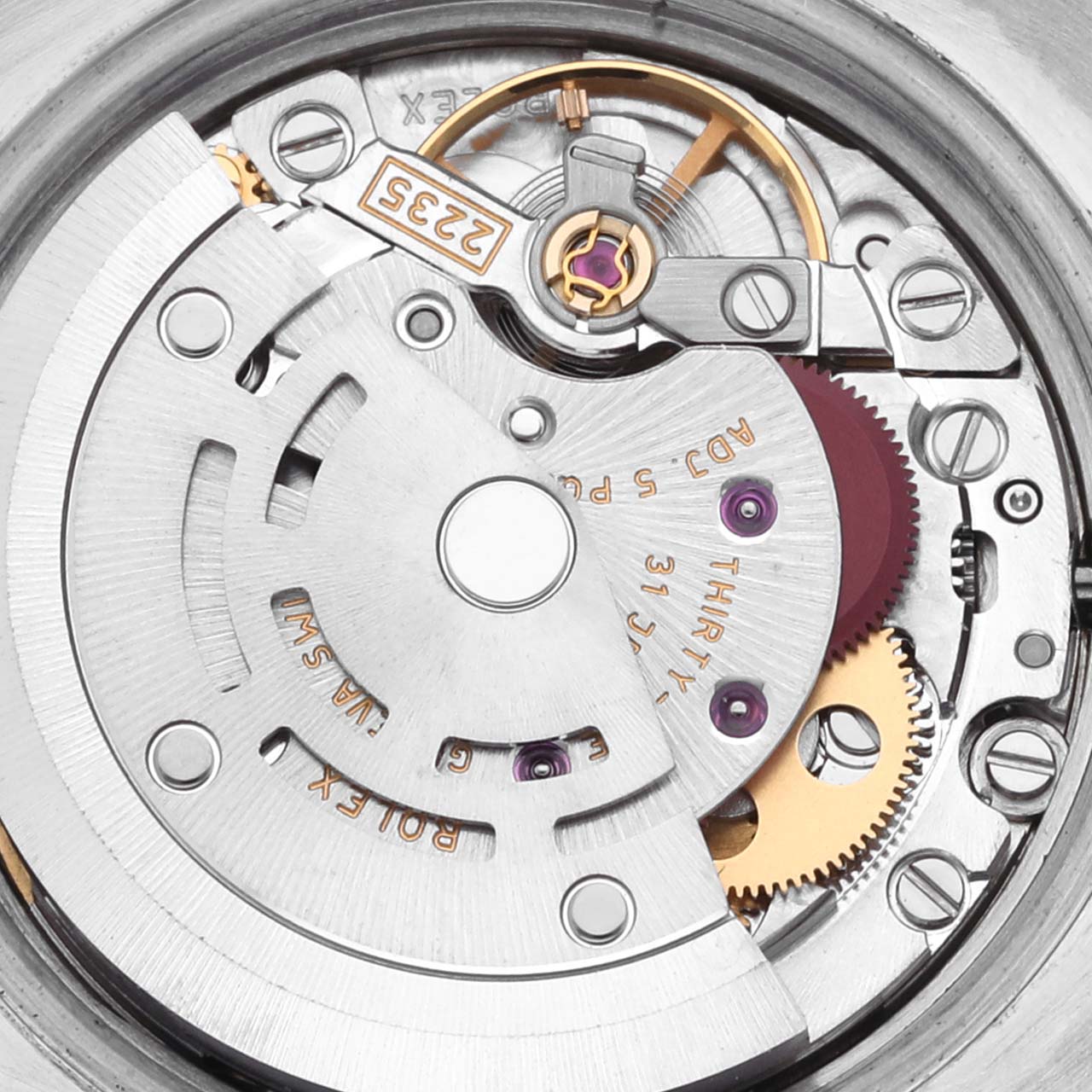 The image shows the internal movement of a Rolex Datejust 179171 Women's Steel and Gold (two tone) Pink Dial 179171 Women's Steel and Gold (two tone) Pink Dial watch, highlighting its intricate mechanical parts.