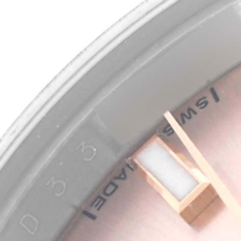 The image shows a close-up of the Rolex Datejust 179171 Women's Steel and Gold (two tone) Pink Dial 179171 Women's Steel and Gold (two tone) Pink Dial face, focusing on the dial's edge and hands.