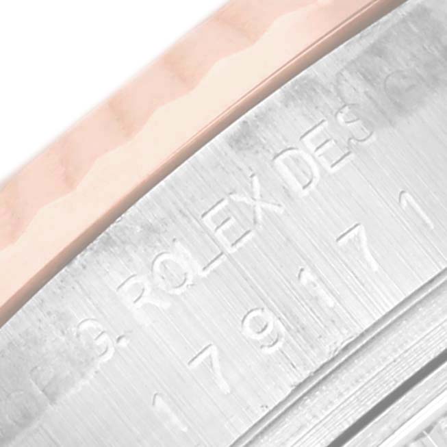 The image shows a close-up of the bezel and engraved inner rim of a Rolex Datejust 179171 Women's Steel and Gold (two tone) Pink Dial 179171 Women's Steel and Gold (two tone) Pink Dial watch.
