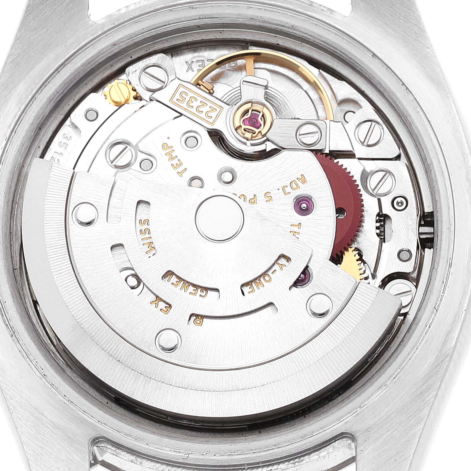 This is a close-up of the internal mechanism of a Rolex Datejust 179174 Women's Stainless Steel Silver Dial 179174 Women's Stainless Steel Silver Dial watch, showing gears and the rotor.