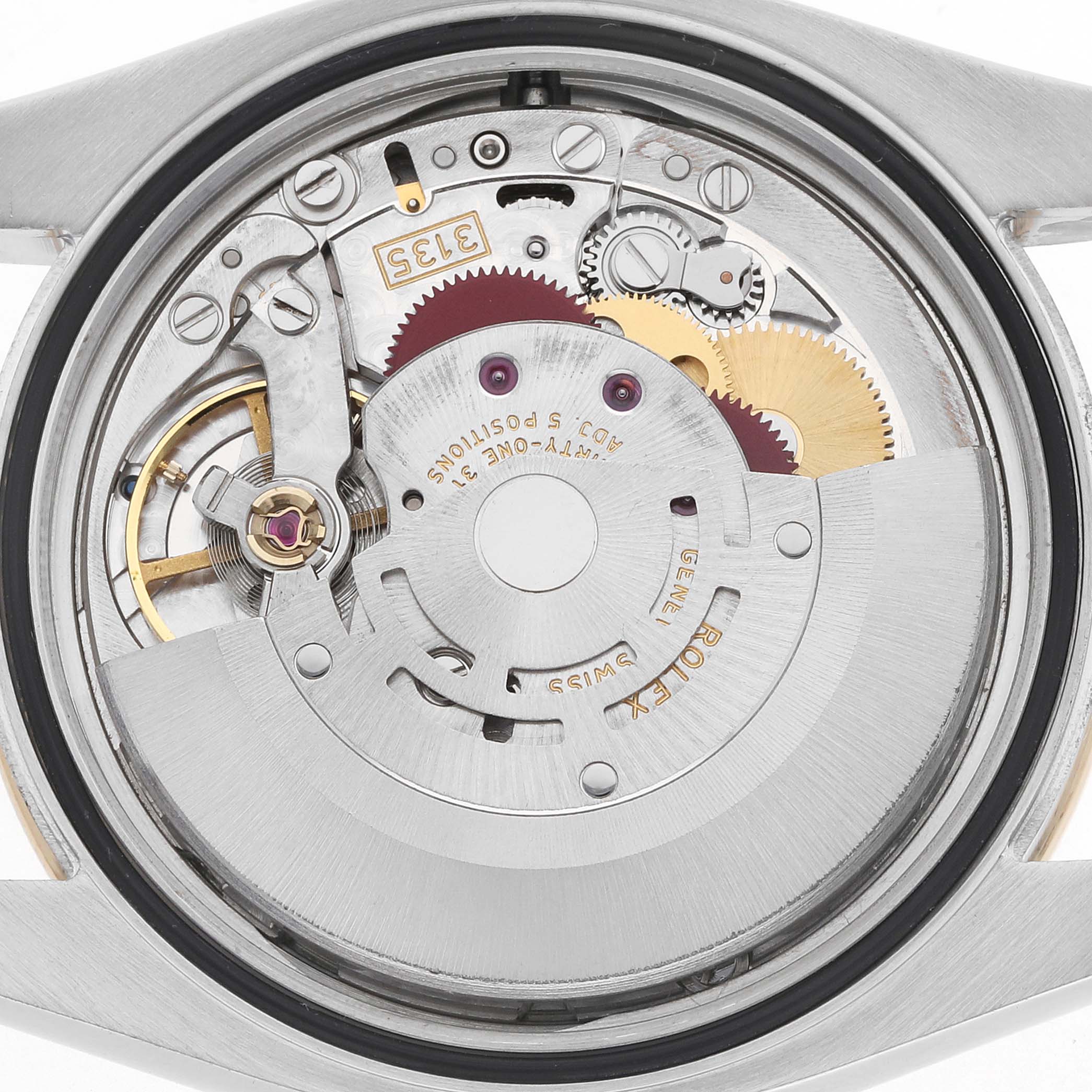 The image shows the movement of a Rolex Datejust 116243 Men
s Steel and Gold (two tone) Silver Dial, displaying gears and inner mechanical parts from a top-down view.