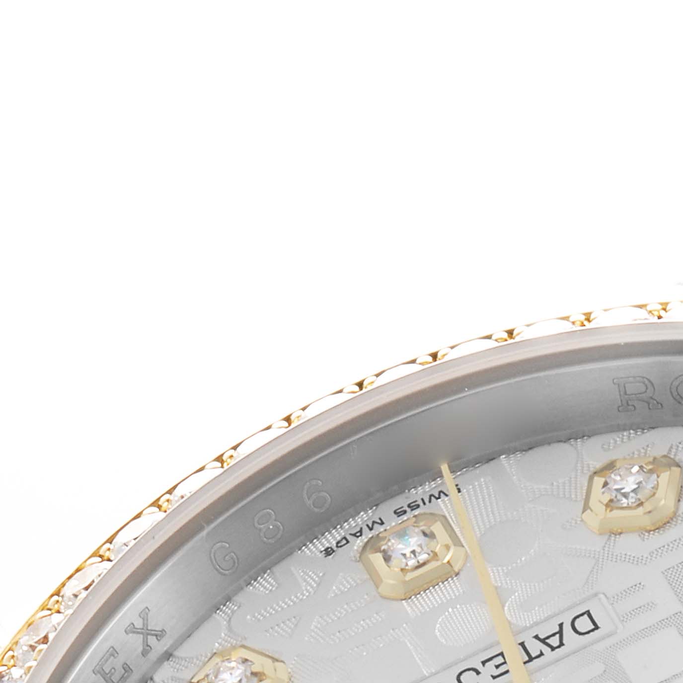 The image shows a close-up of the Rolex Datejust 116243 Men
s Steel and Gold (two tone) Silver Dial
s dial and bezel featuring diamond hour markers and part of the engraved text.