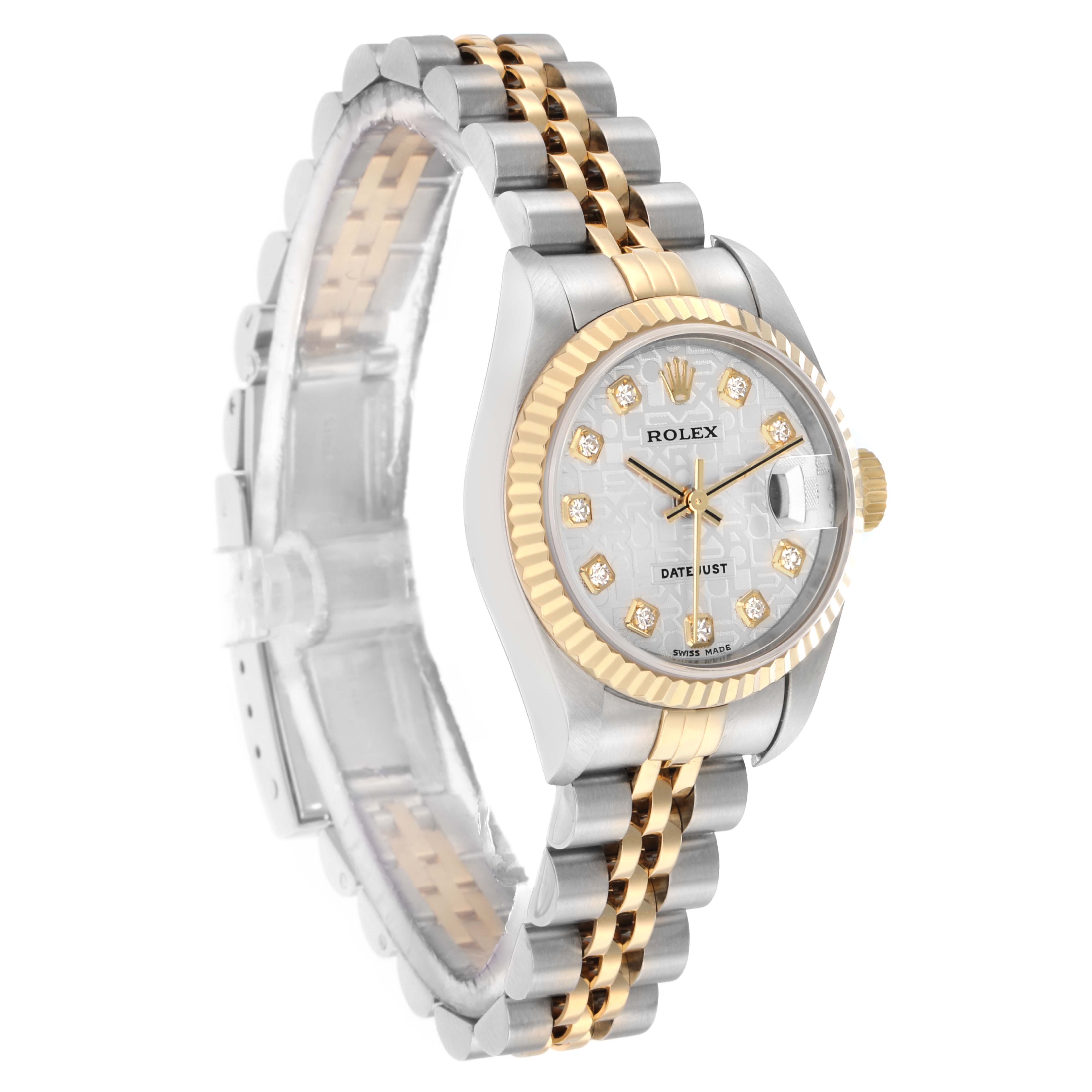 The Rolex Datejust 79173 Women
s Steel and Gold (two tone) Champagne Dial watch is shown at an angled side view, highlighting its two-tone bracelet, bezel, and diamond hour markers.