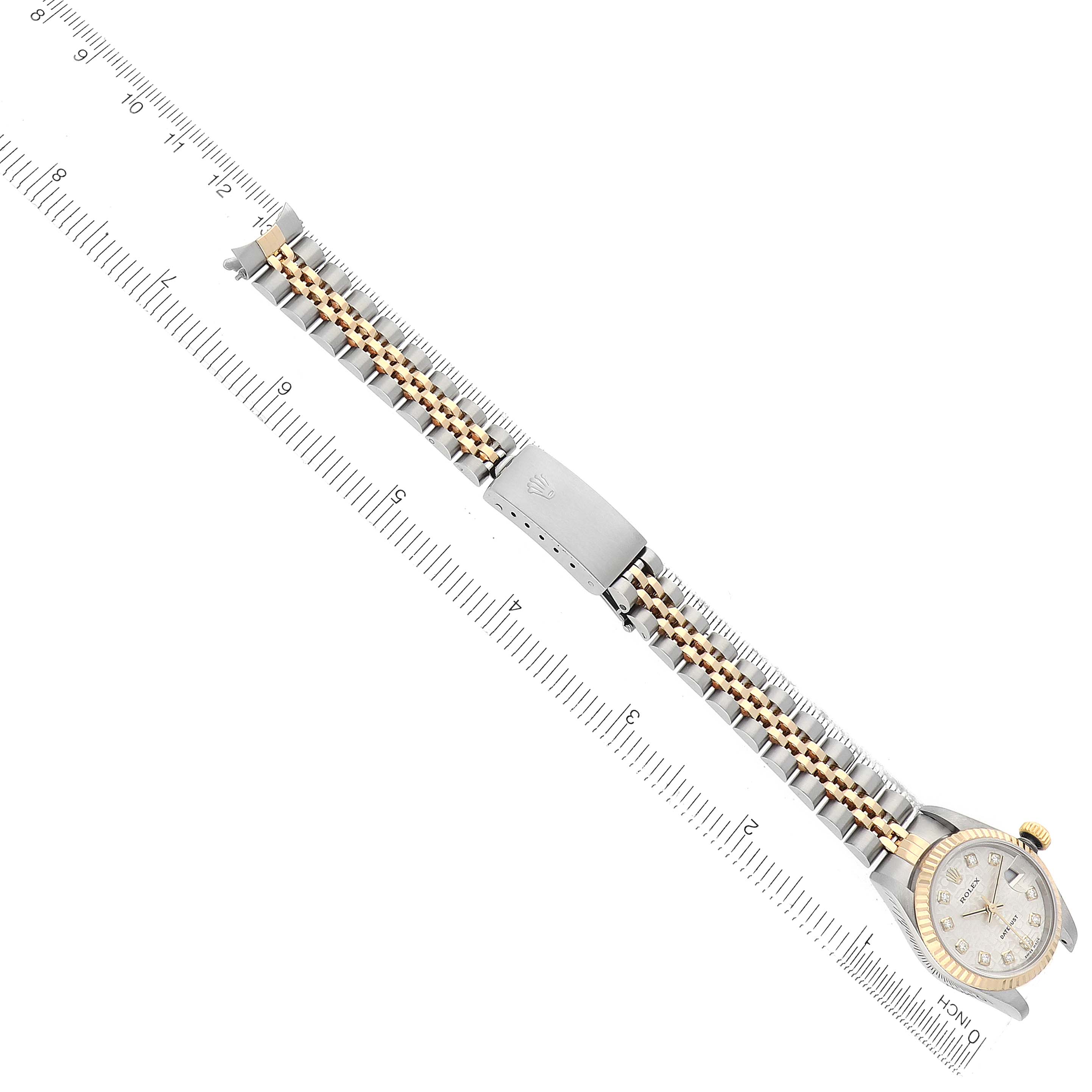 The image shows a Rolex Datejust 79173 Women
s Steel and Gold (two tone) Champagne Dial watch viewed from above, highlighting the bracelet, clasp, and face.