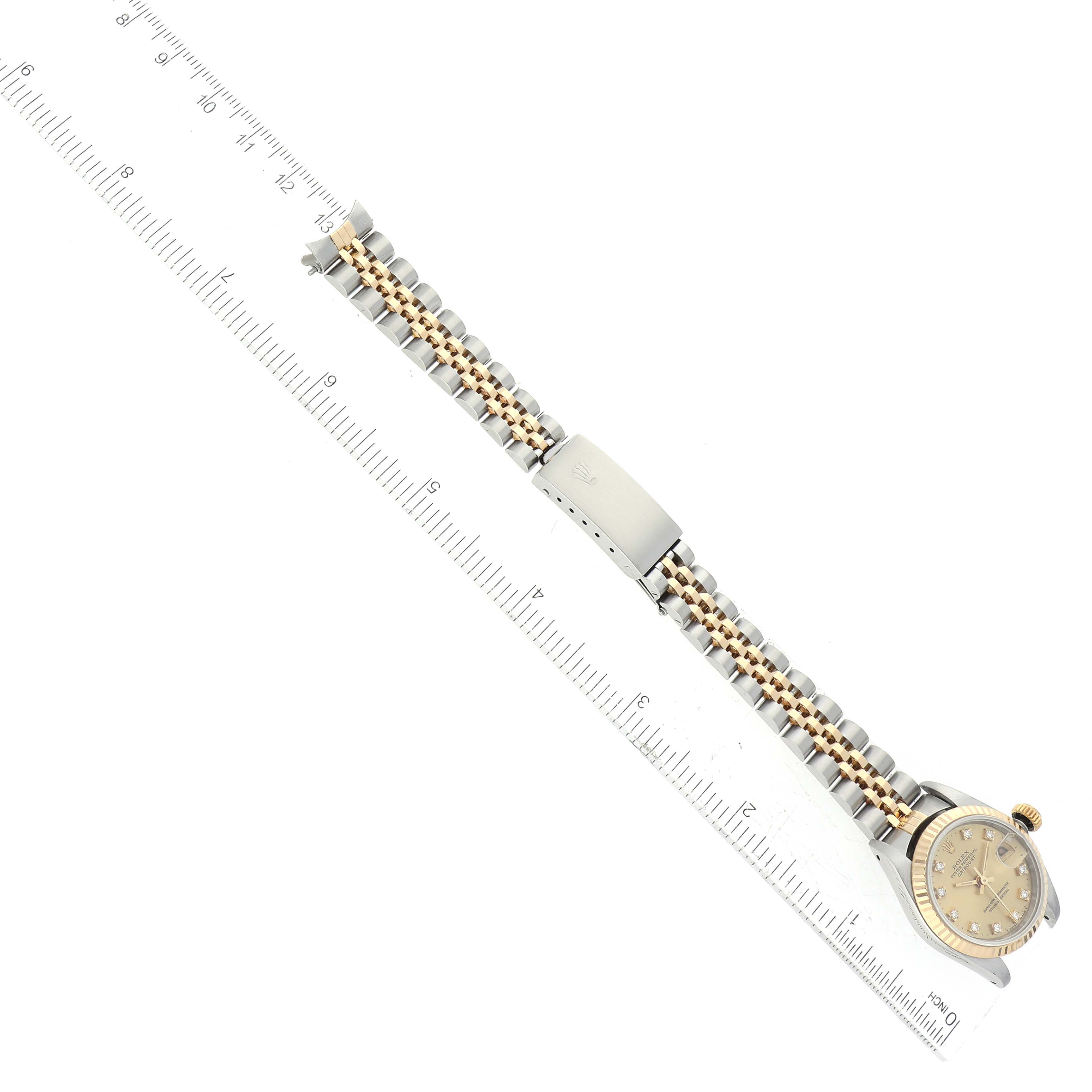 The Rolex Datejust 69173 Women's Steel and Gold (two tone) Champagne Dial 69173 Women's Steel and Gold (two tone) Champagne Dial watch is shown from an overhead angle, displaying the full bracelet and dial.