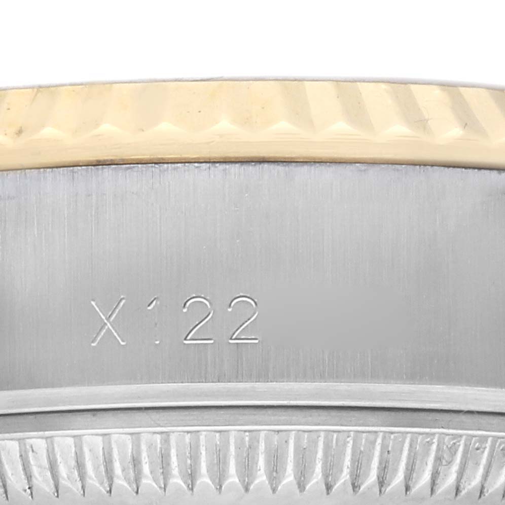 The image shows a close-up of the serial number and the fluted bezel of a Rolex Datejust 69173 Women's Steel and Gold (two tone) Champagne Dial 69173 Women's Steel and Gold (two tone) Champagne Dial watch.