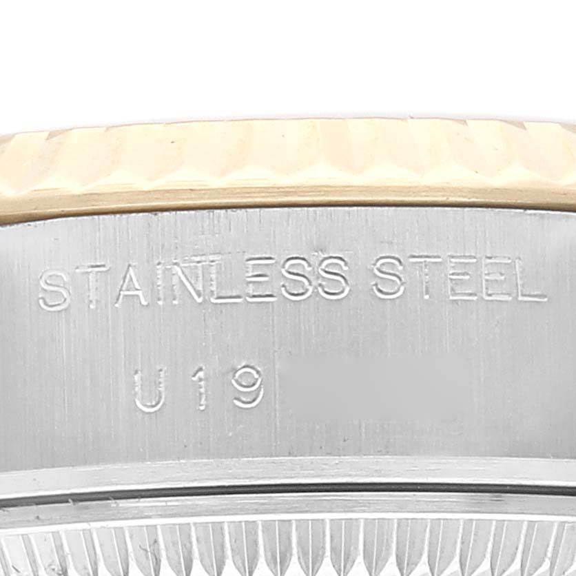 This close-up angle shows the side of the stainless steel case and fluted bezel of a Rolex Datejust 69173 Women's Stainless Steel Champagne Dial 69173 Women's Stainless Steel Champagne Dial watch.