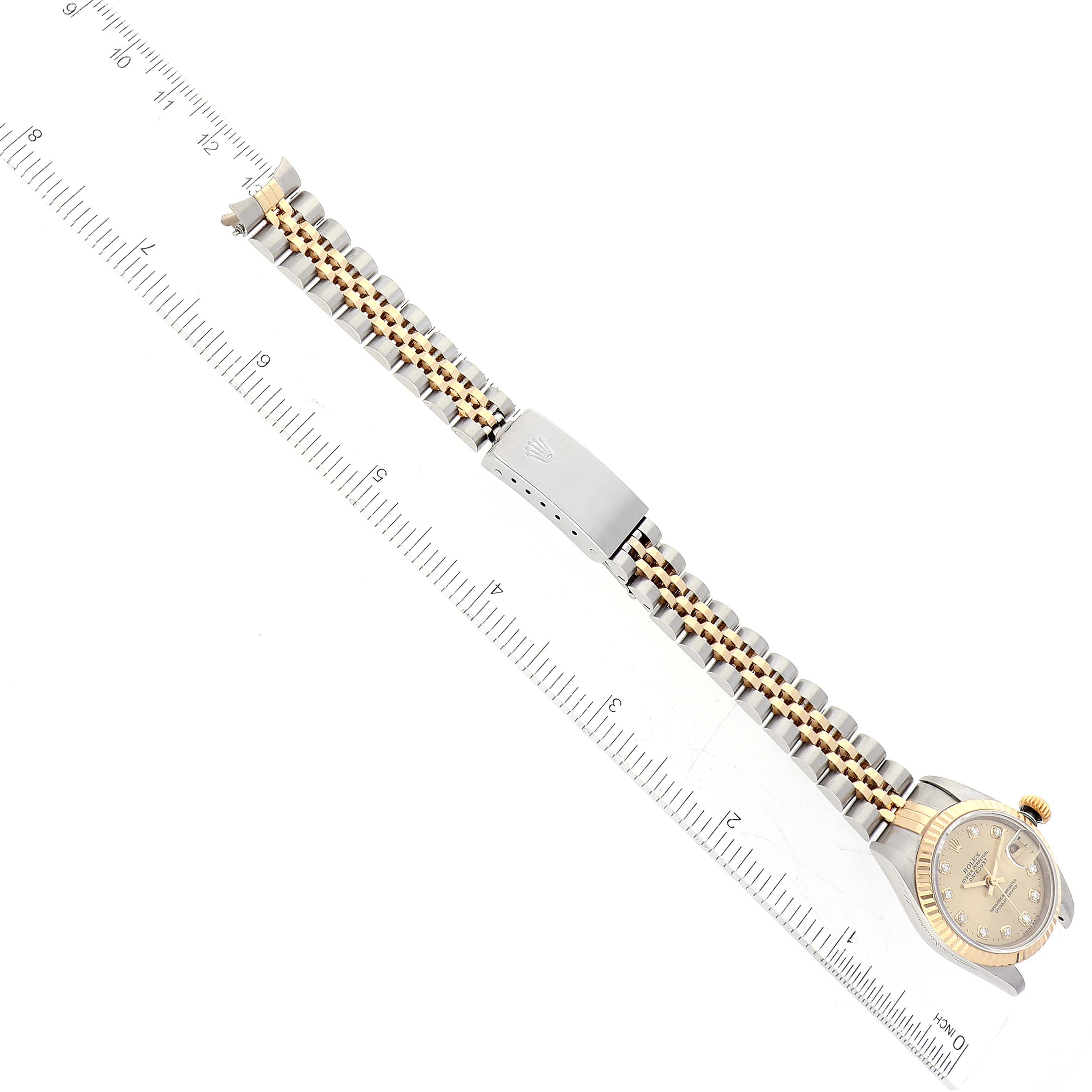 The image shows a Rolex Datejust 69173 Women's Stainless Steel Champagne Dial 69173 Women's Stainless Steel Champagne Dial watch displayed flat with its wristband fully extended against a measuring ruler.