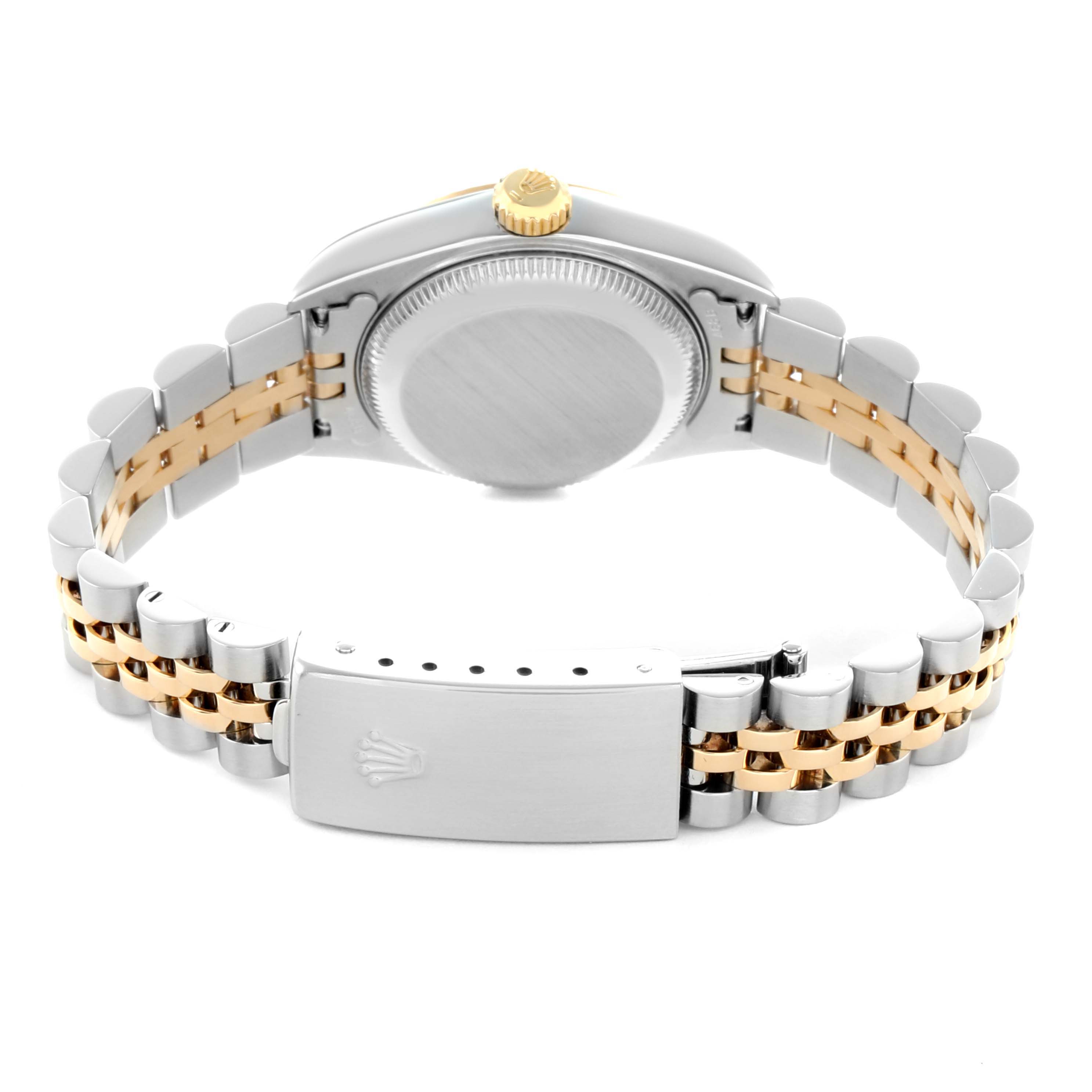 The Rolex Datejust 79173 Women
s Steel and Gold (two tone) Champagne Dial watch is shown from the back, displaying the clasp, bracelet, case back, and crown.