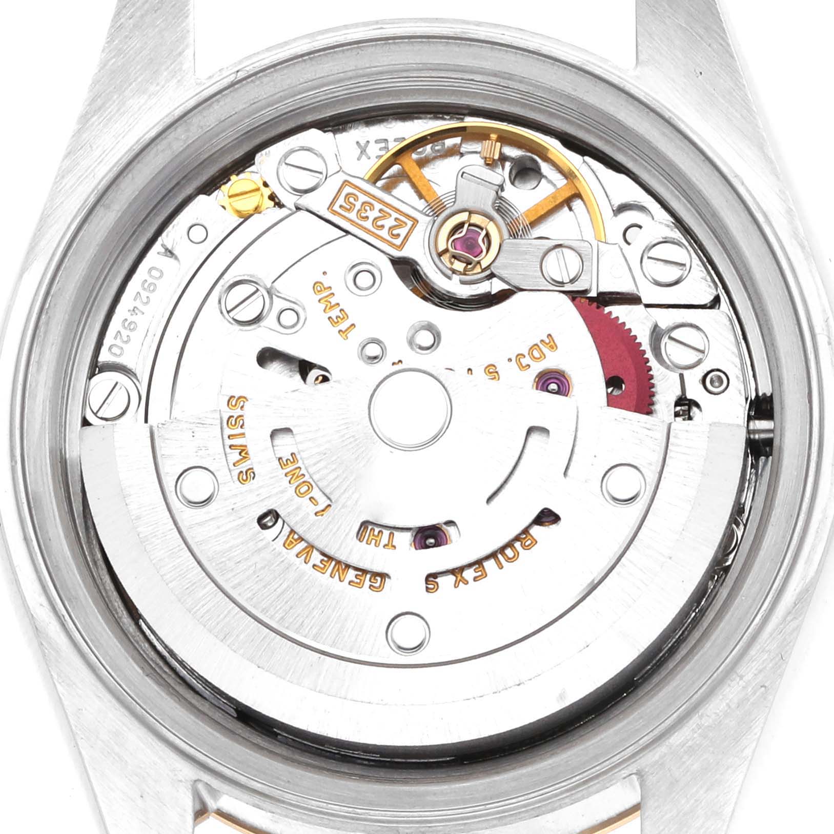 The image shows the movement of a Rolex Datejust 79173 Women
s Steel and Gold (two tone) Champagne Dial watch from the back, highlighting the rotor and other internal components.
