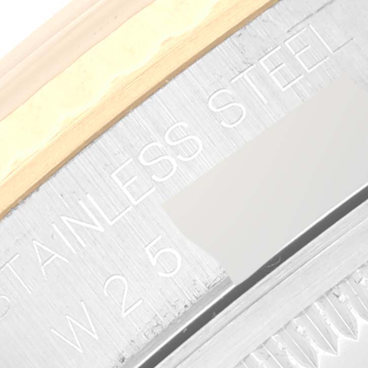 This close-up image of a Rolex Datejust 16233 Men's Steel and Gold (two tone) Champagne Dial 16233 Men's Steel and Gold (two tone) Champagne Dial watch showcases part of the stainless steel case and bezel.