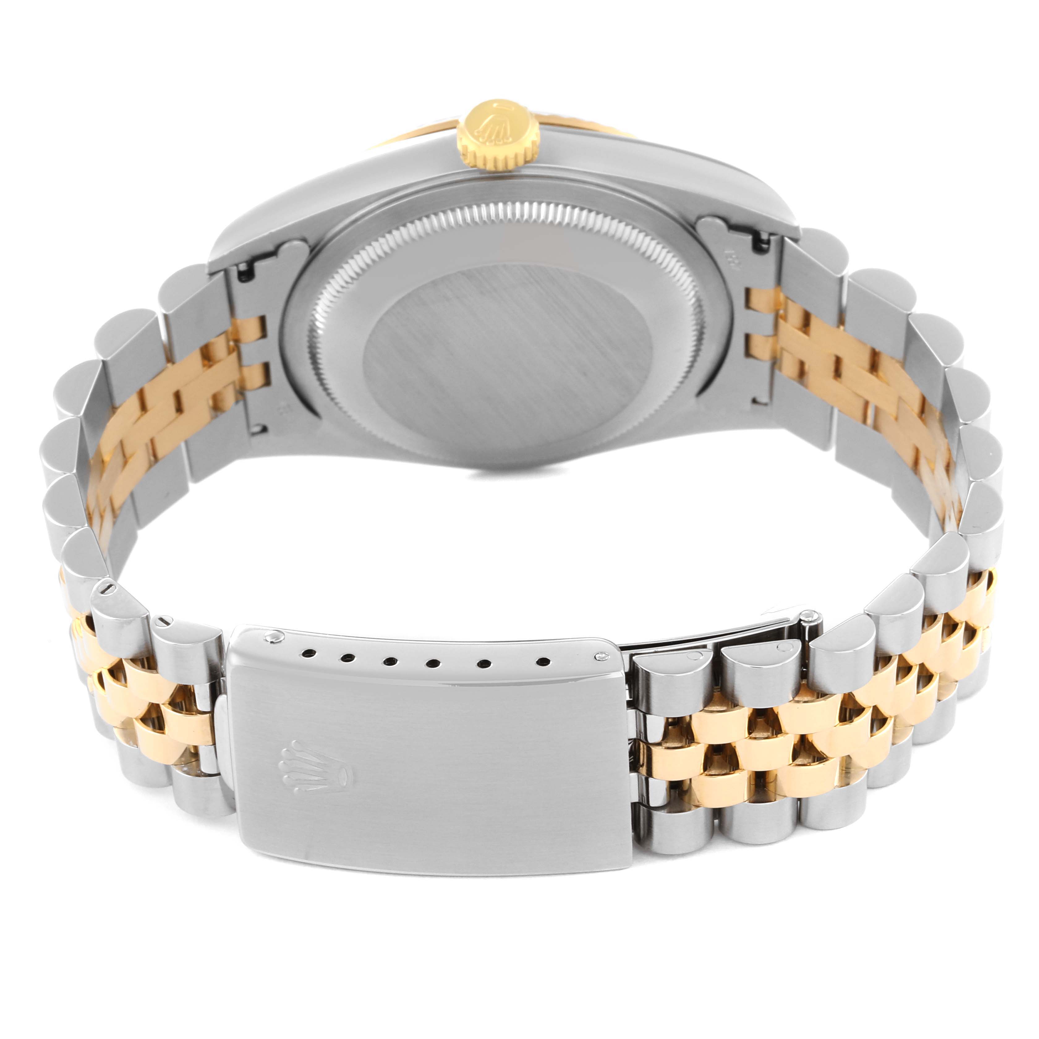 This image shows the back case and bracelet clasp of a Rolex Datejust 16233 Men's Steel and Gold (two tone) Champagne Dial 16233 Men's Steel and Gold (two tone) Champagne Dial watch, with a two-tone band.