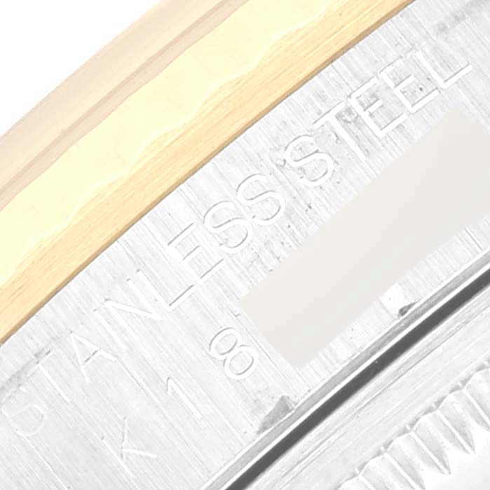 The image shows a close-up angle of the case edge and bezel of a Rolex Datejust 16233 Men's Steel and Gold (two tone) Champagne Dial 16233 Men's Steel and Gold (two tone) Champagne Dial watch, with "STAINLESS STEEL" engraved.