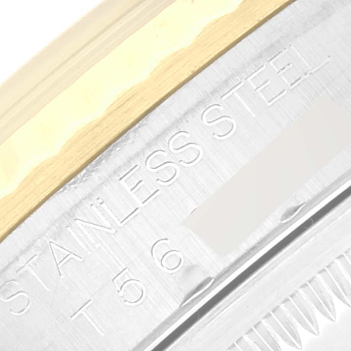 This close-up image shows the stainless steel part of the Rolex Datejust 16233 Men's Steel and Gold (two tone) Mother of Pearl Dial 16233 Men's Steel and Gold (two tone) Mother of Pearl Dial watch, highlighting "STAINLESS STEEL" engraving on the case.