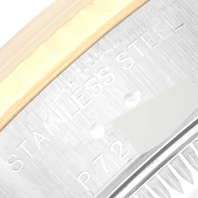 This image shows a close-up of the case back edge of a Rolex Datejust 79173 Women's Steel and Gold (two tone) White Dial 79173 Women's Steel and Gold (two tone) White Dial watch, highlighting the stainless steel material.