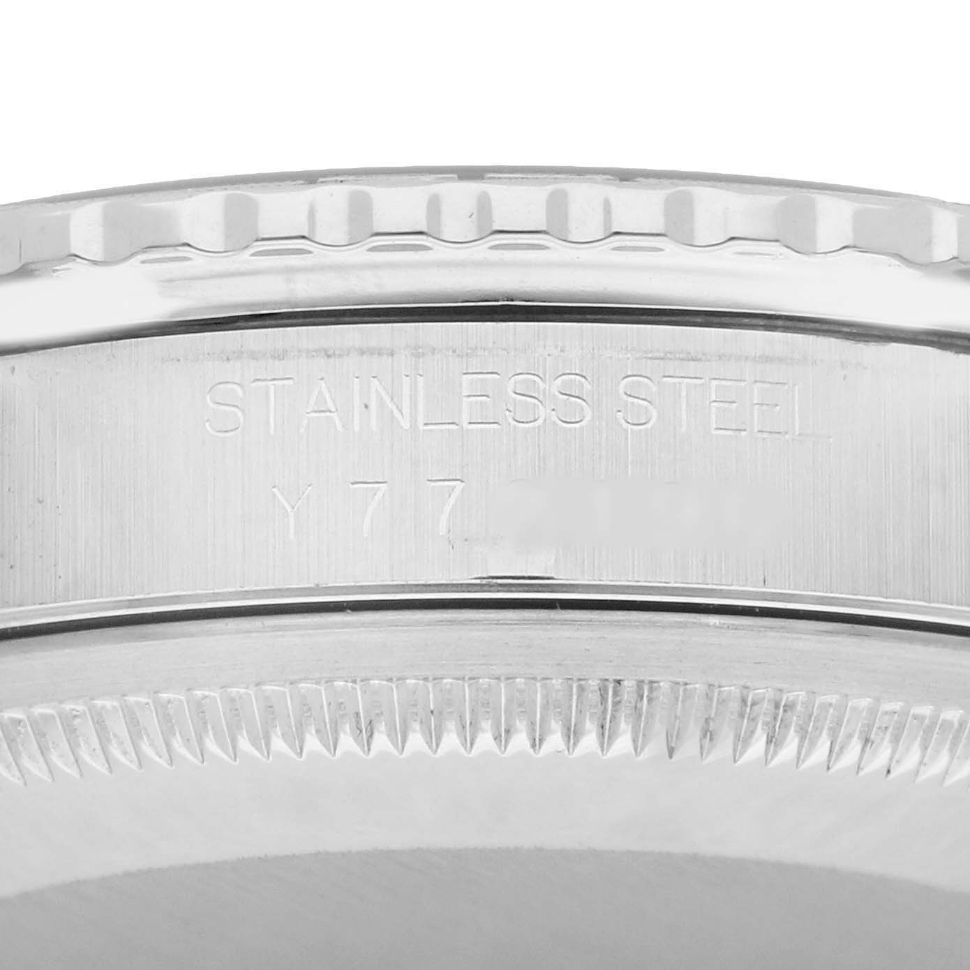 The image shows the side view of the bezel and case side of a Rolex Turn-o-Graph 16264 Men
s Stainless Steel Blue Dial, focusing on the engraved "Stainless Steel" marking.