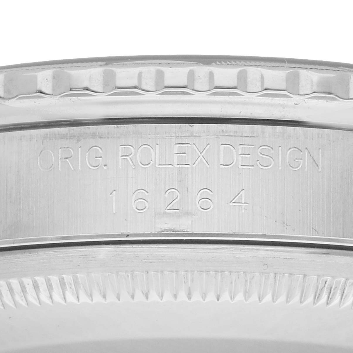 The image shows the side of a Rolex Turn-o-Graph 16264 Men
s Stainless Steel Blue Dial bezel with engraved model details.