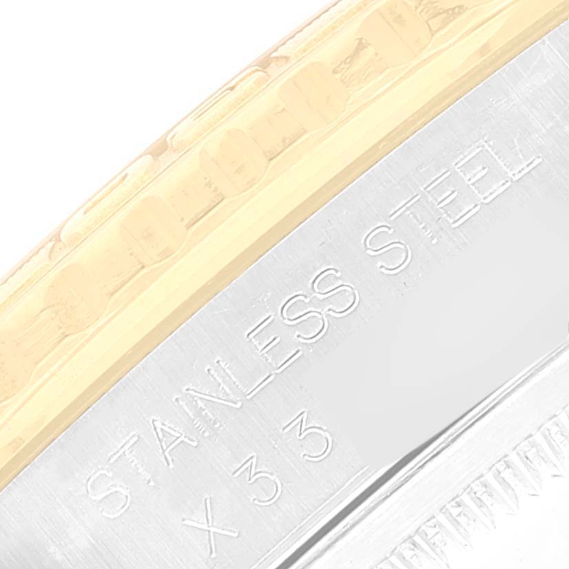 The image shows a close-up side angle of the bezel and case of a Rolex Turn-o-Graph 16263 Men
s Steel and Gold (two tone) Black Dial 16263 Men
s Steel and Gold (two tone) Black Dial watch, highlighting the "Stainless Steel" engraving.