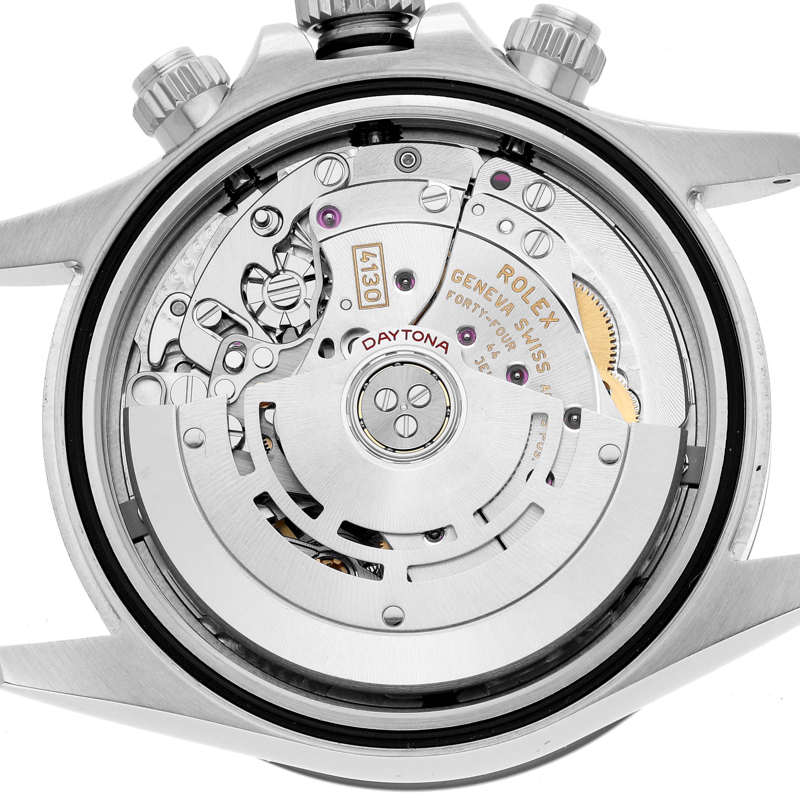 The image shows the back view of the Rolex Daytona 116500 Men
s Stainless Steel Black Dial model, focusing on its intricate movement and internal mechanisms.