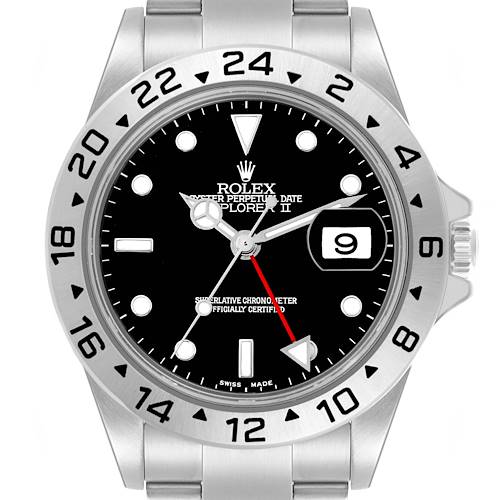 The image shows a Rolex Explorer II's face and part of the bracelet from a front view, highlighting the bezel and dial details.