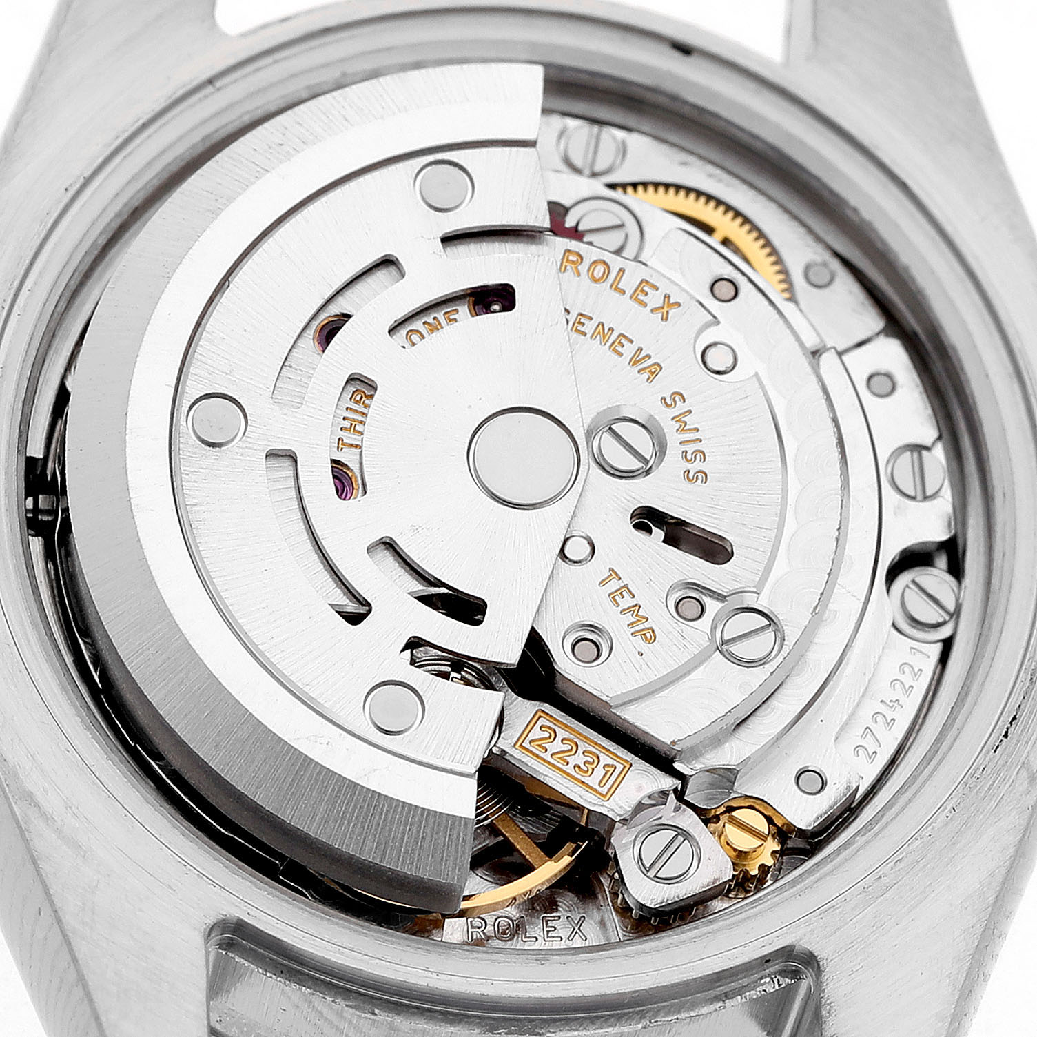 The image shows the movement of a Rolex Oyster Perpetual 176200 Women's Stainless Steel Silver Dial watch from a rear angle, highlighting the rotor and various mechanical components.