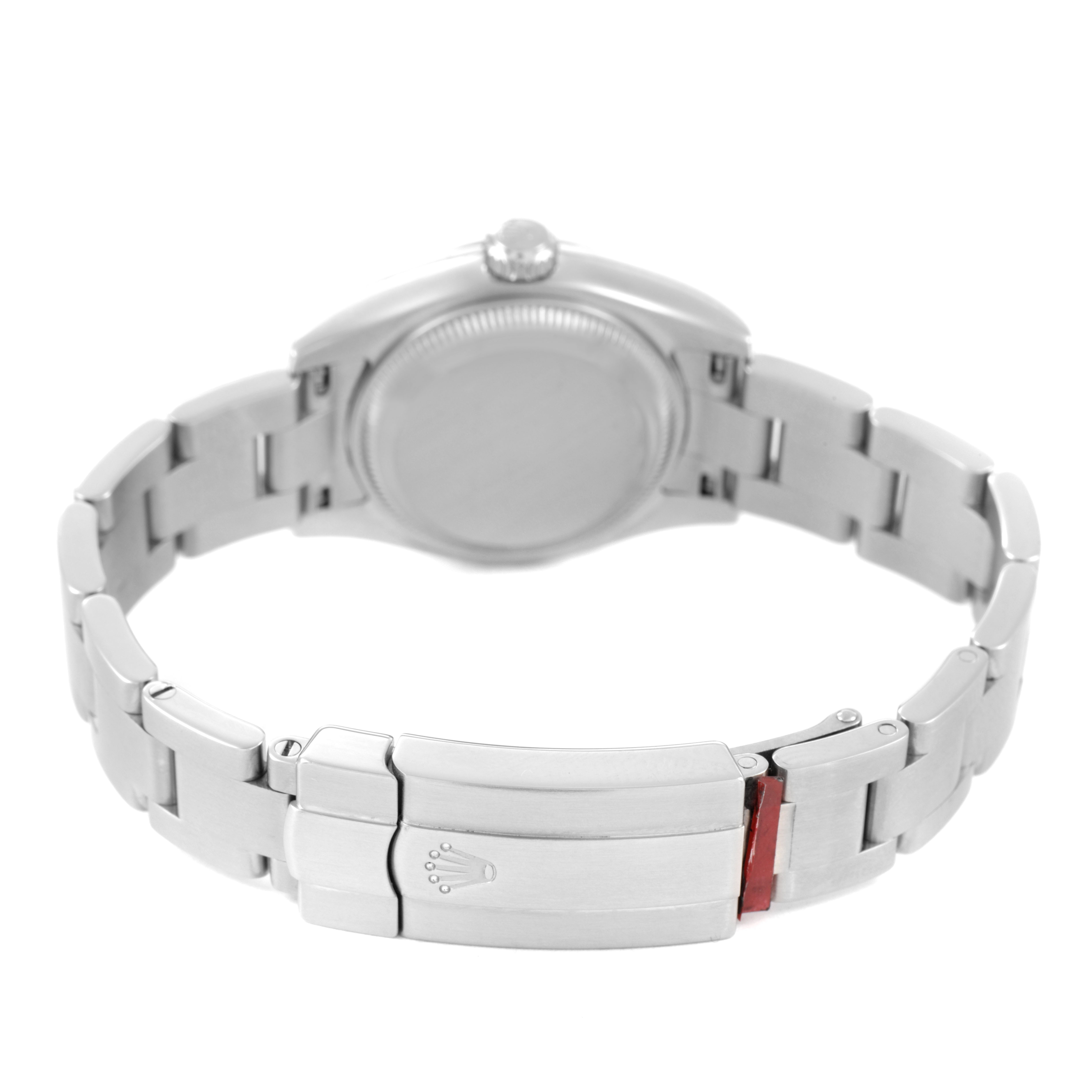 The image shows the back of the Oyster Perpetual by Rolex, highlighting the clasp and bracelet links.