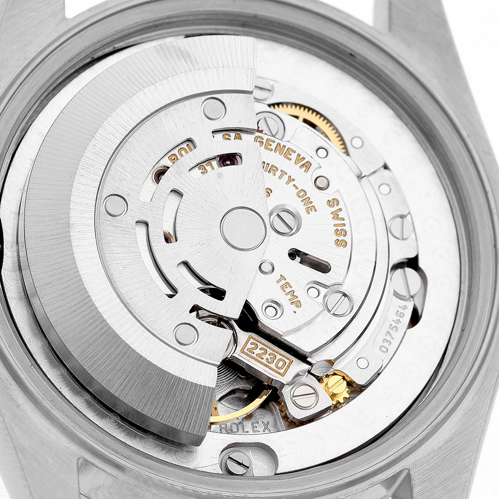 The image shows the movement of a Rolex Mid-Size 77080 Women's Stainless Steel Pink Dial watch from a top-down angle.