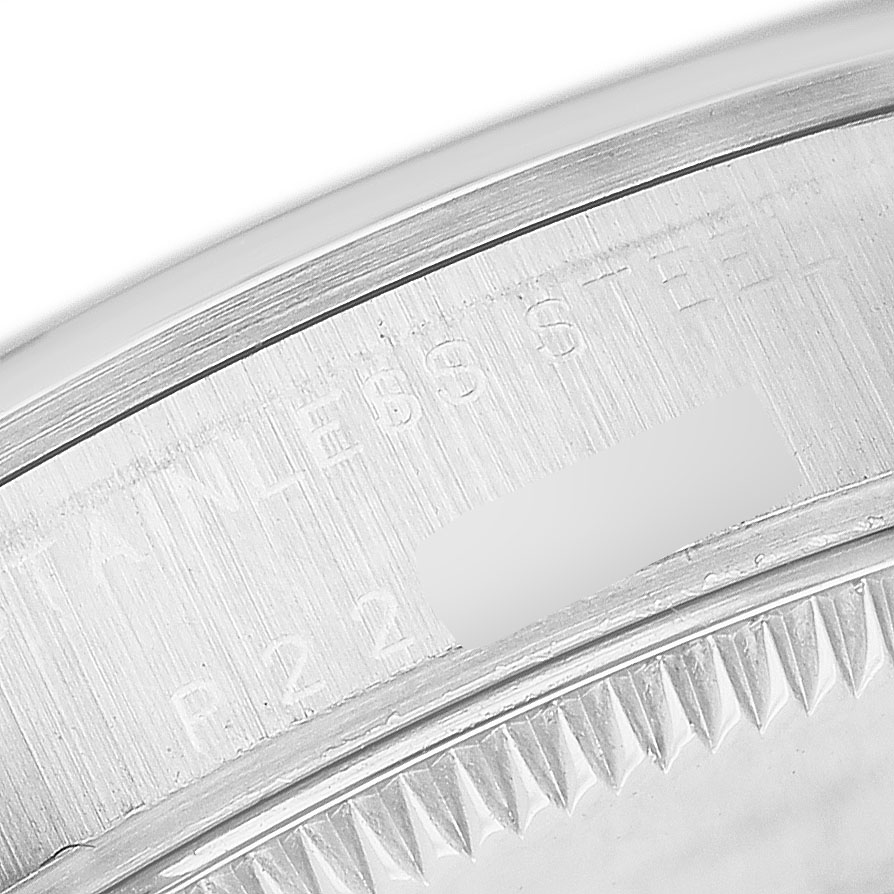 The image shows a close-up of the side and edge of a Rolex Mid-Size 77080 Women's Stainless Steel Pink Dial model, highlighting the stainless steel details.