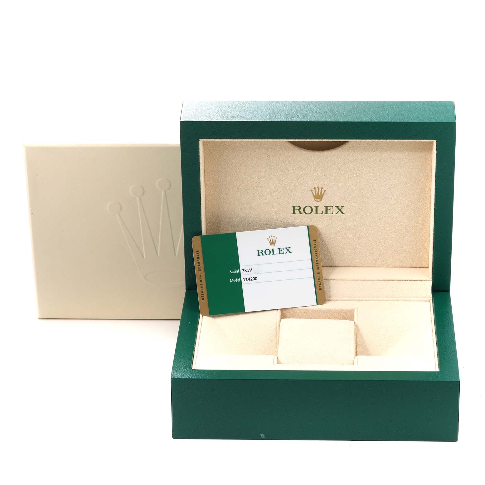 This image shows the open box and authenticity card of a Rolex Oyster Perpetual 114200 Men's Stainless Steel White Dial 114200 Men's Stainless Steel White Dial model.