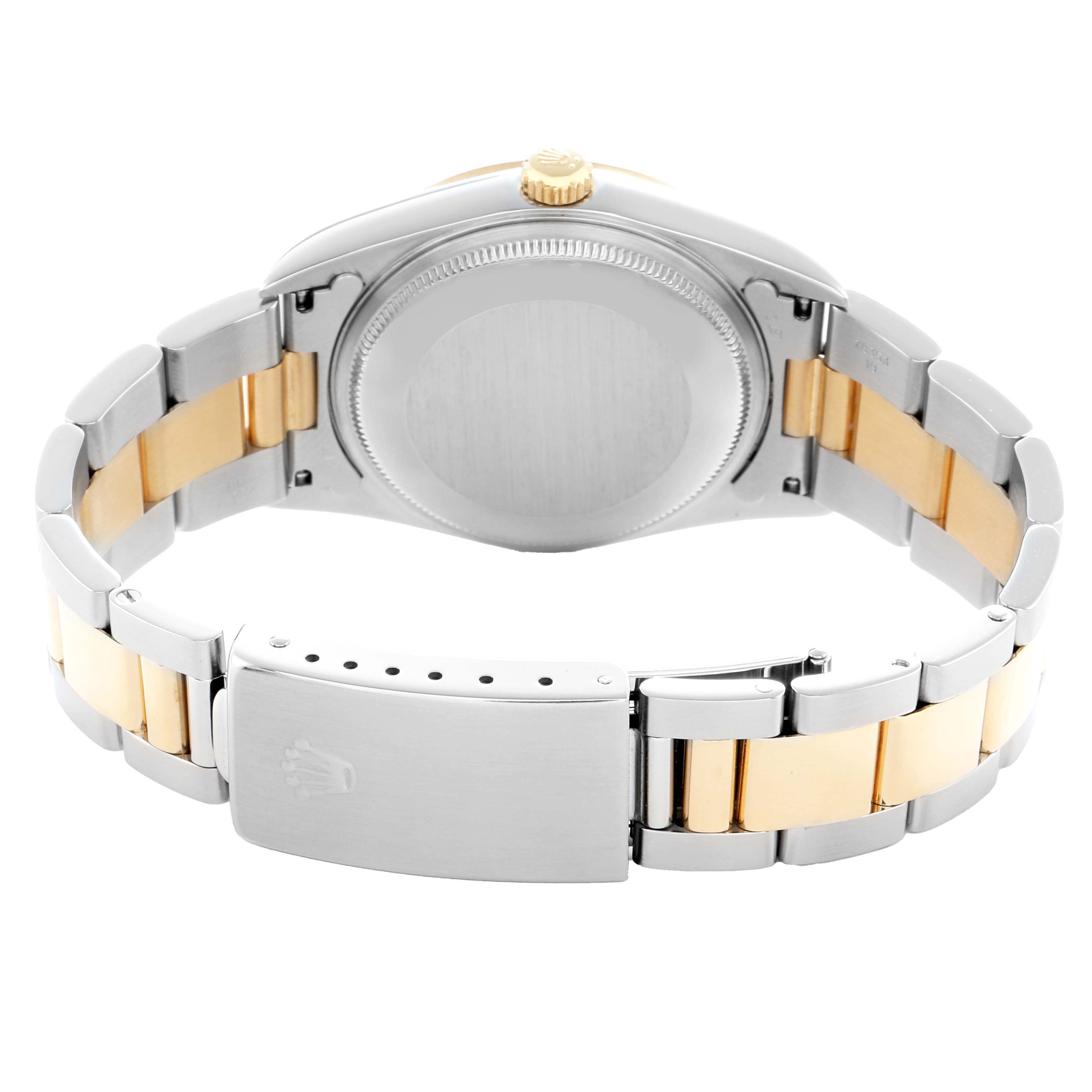 The image shows the back of a Rolex Oyster Perpetual 14203 Men
s Steel and Gold (two tone) Champagne Dial watch, highlighting the bracelet, clasp, and case back.