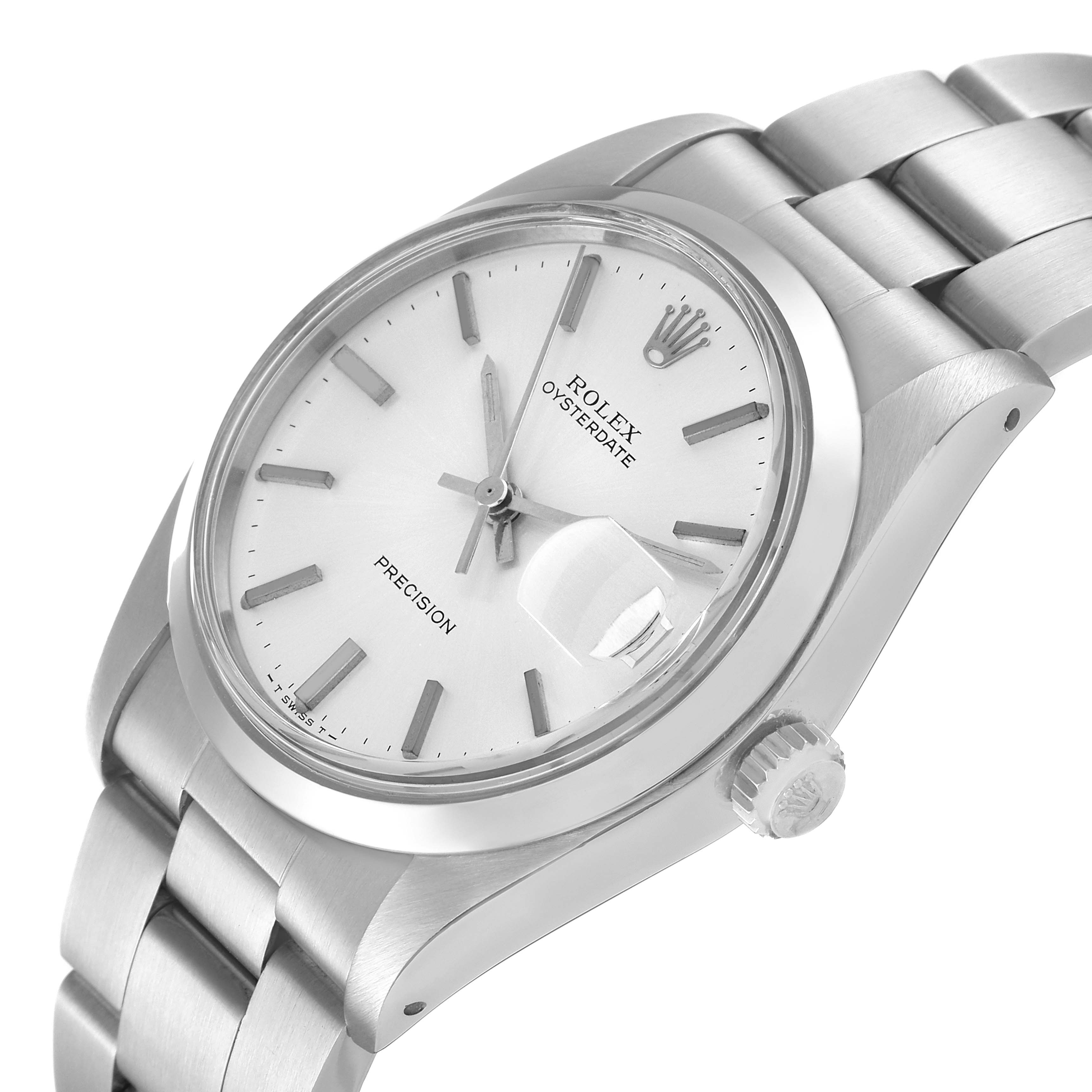 The image shows the Rolex Vintage Collection 6694 Men
s Stainless Steel Silver Dial 6694 Men
s Stainless Steel Silver Dial Oysterdate watch, focusing on its face, crown, and part of the bracelet at an angled view.