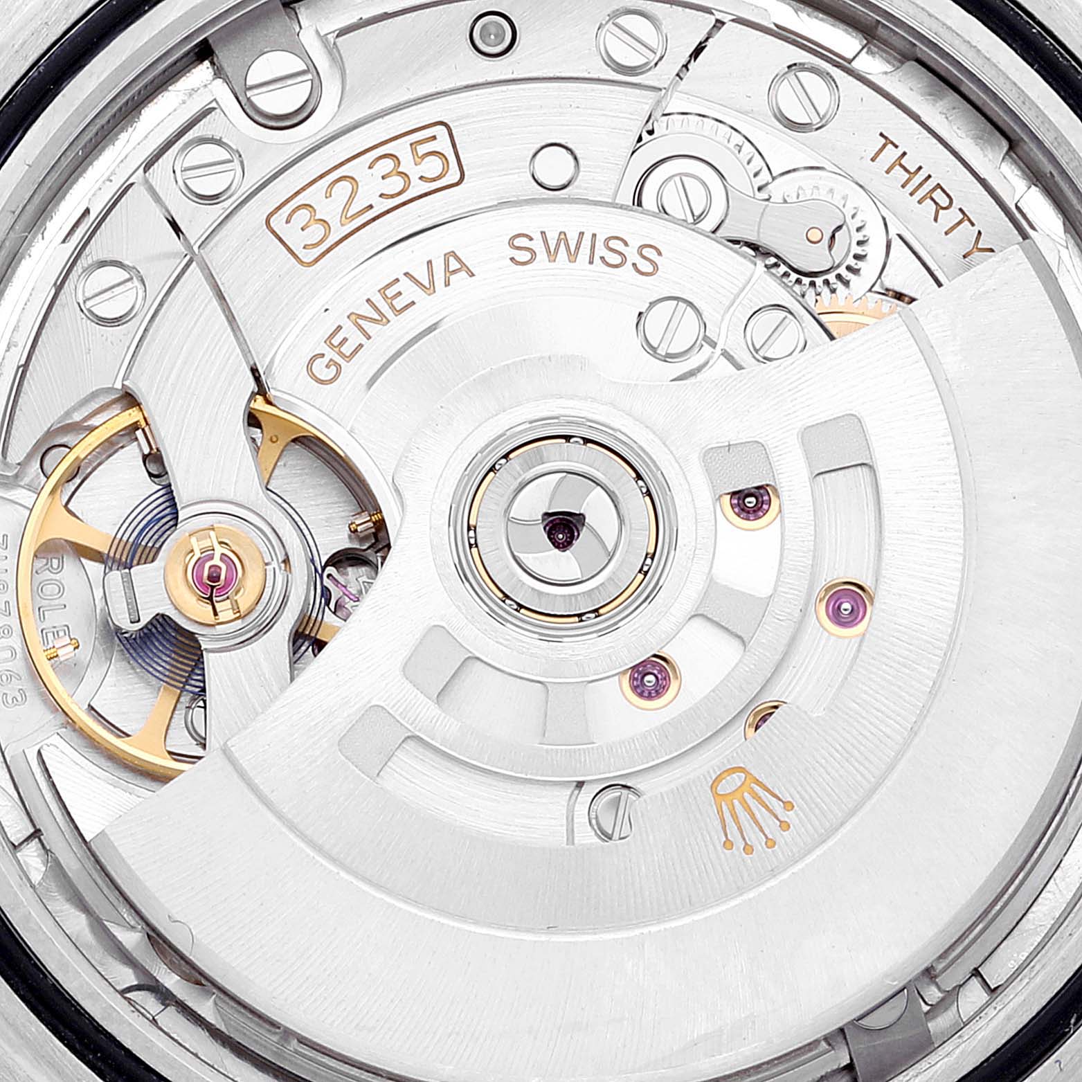 The image shows a close-up of the inner mechanical movement of a Rolex Datejust 41 126334 Men's Stainless Steel Silver Dial 126334 Men's Stainless Steel Silver Dial model, highlighting the gears and rotor.