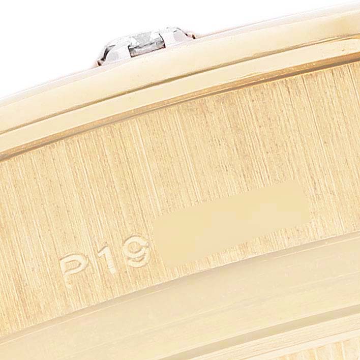 The image shows a close-up of the side and part of the bezel of the Rolex Pearlmaster 80318 Women's Yellow Gold Mother of Pearl Dial 80318 Women's Yellow Gold Mother of Pearl Dial watch.