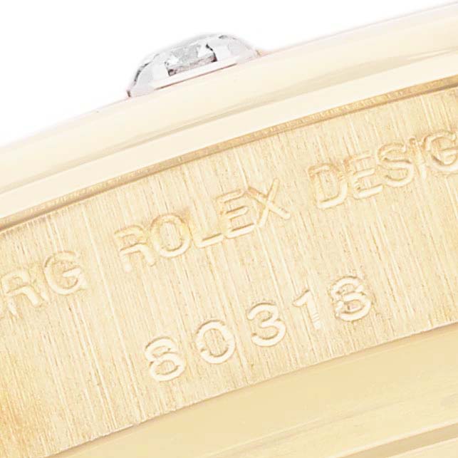 The image shows a close-up of the case side with engravings of the Rolex Pearlmaster 80318 Women's Yellow Gold Mother of Pearl Dial 80318 Women's Yellow Gold Mother of Pearl Dial model.