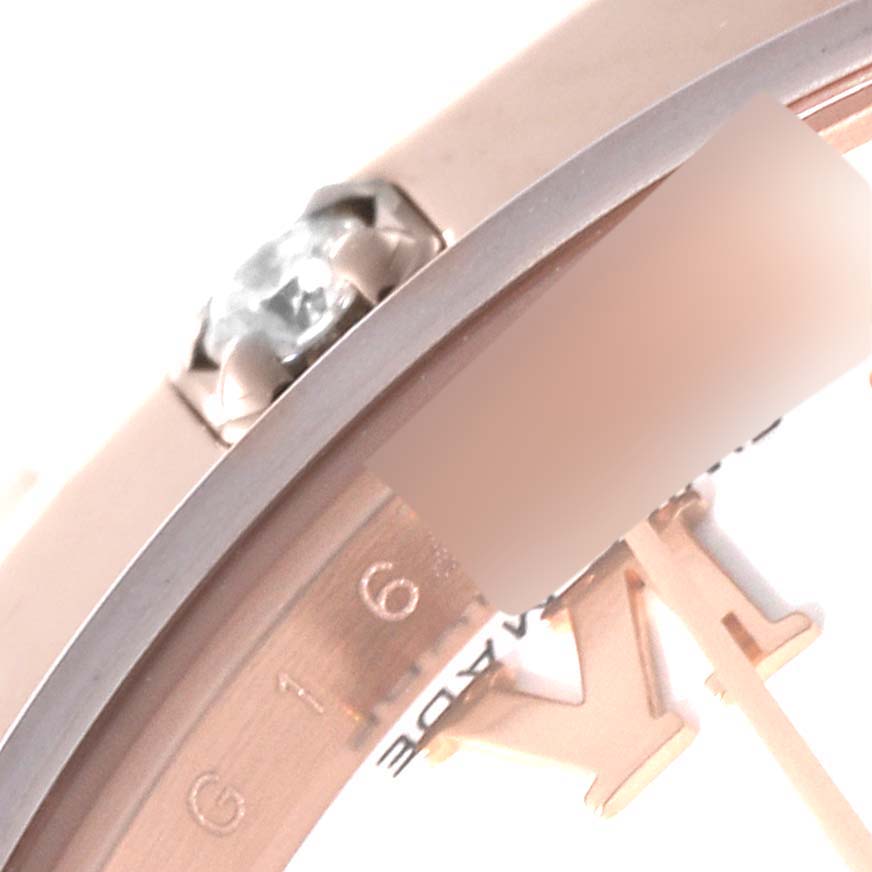 This is a close-up shot of a Rolex Pearlmaster 80315 Women's Rose Gold White Dial 80315 Women's Rose Gold White Dial watch, focusing on the bezel, a diamond setting, and part of the dial.