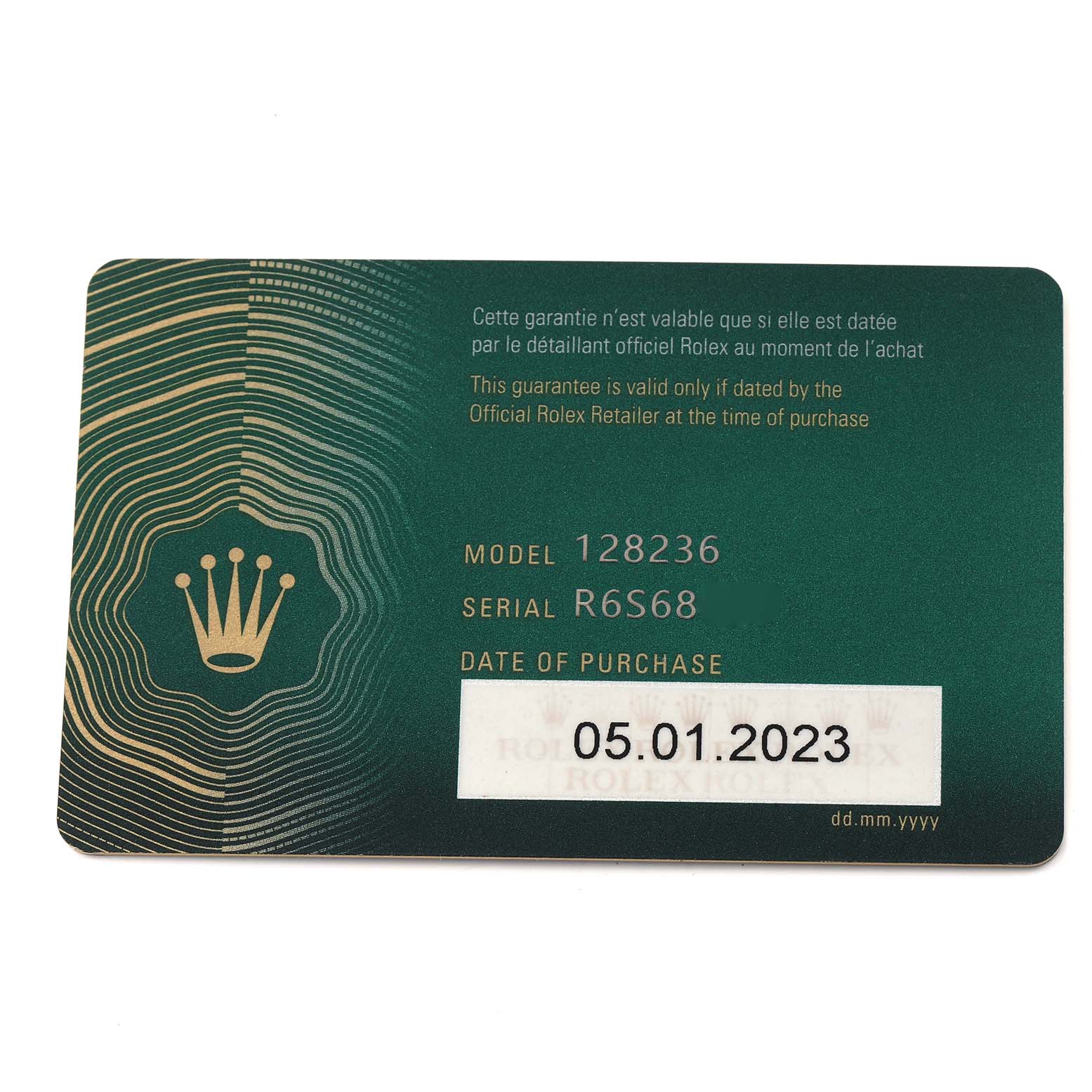 This image shows a guarantee card for a Rolex President 128236 Men
s Platinum Blue Dial model, displaying the model number, serial number, and purchase date.