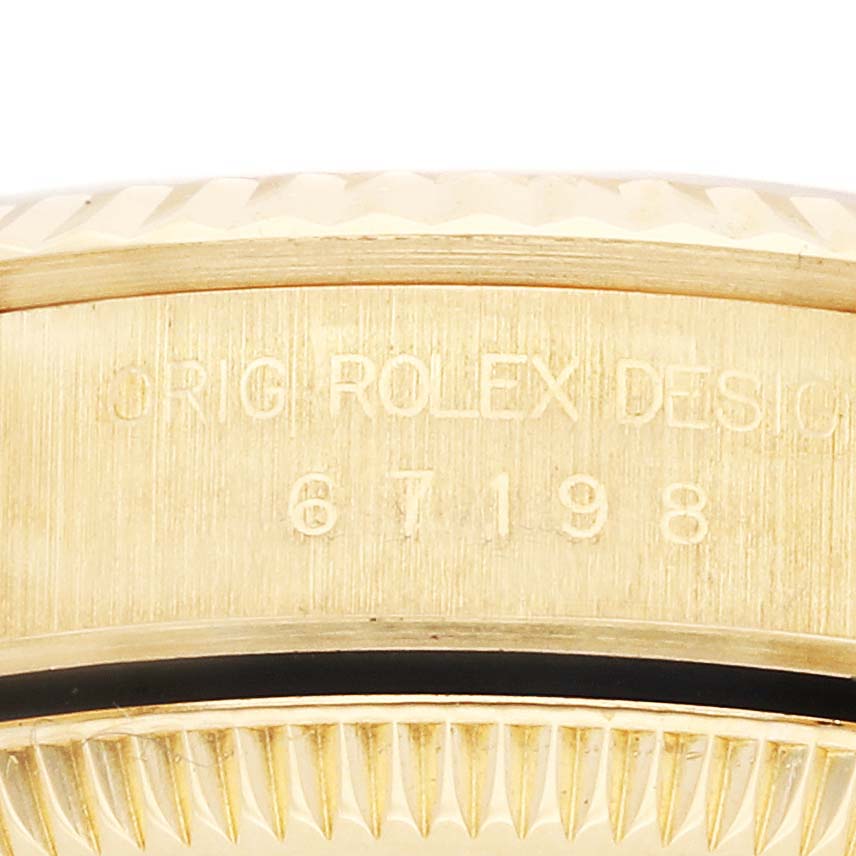 The image shows a close-up of the bezel and case side of the Rolex President 67198 Women's Yellow Gold Champagne Dial 67198 Women's Yellow Gold Champagne Dial model, highlighting the engraved reference number.