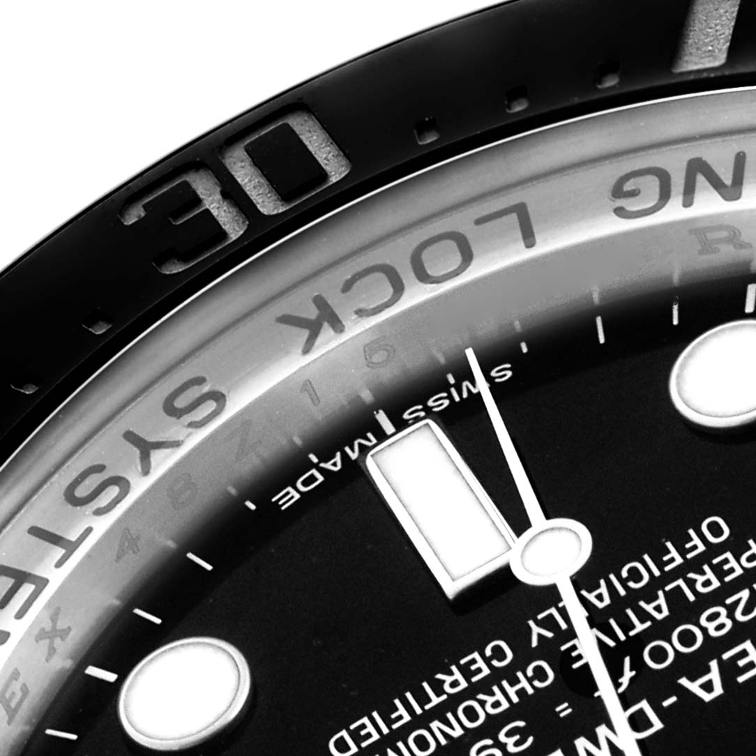 The image shows a close-up of the Rolex Sea-Dweller 116660 Men
s Stainless Steel Black Dial
s bezel, dial edge, and part of the hands.