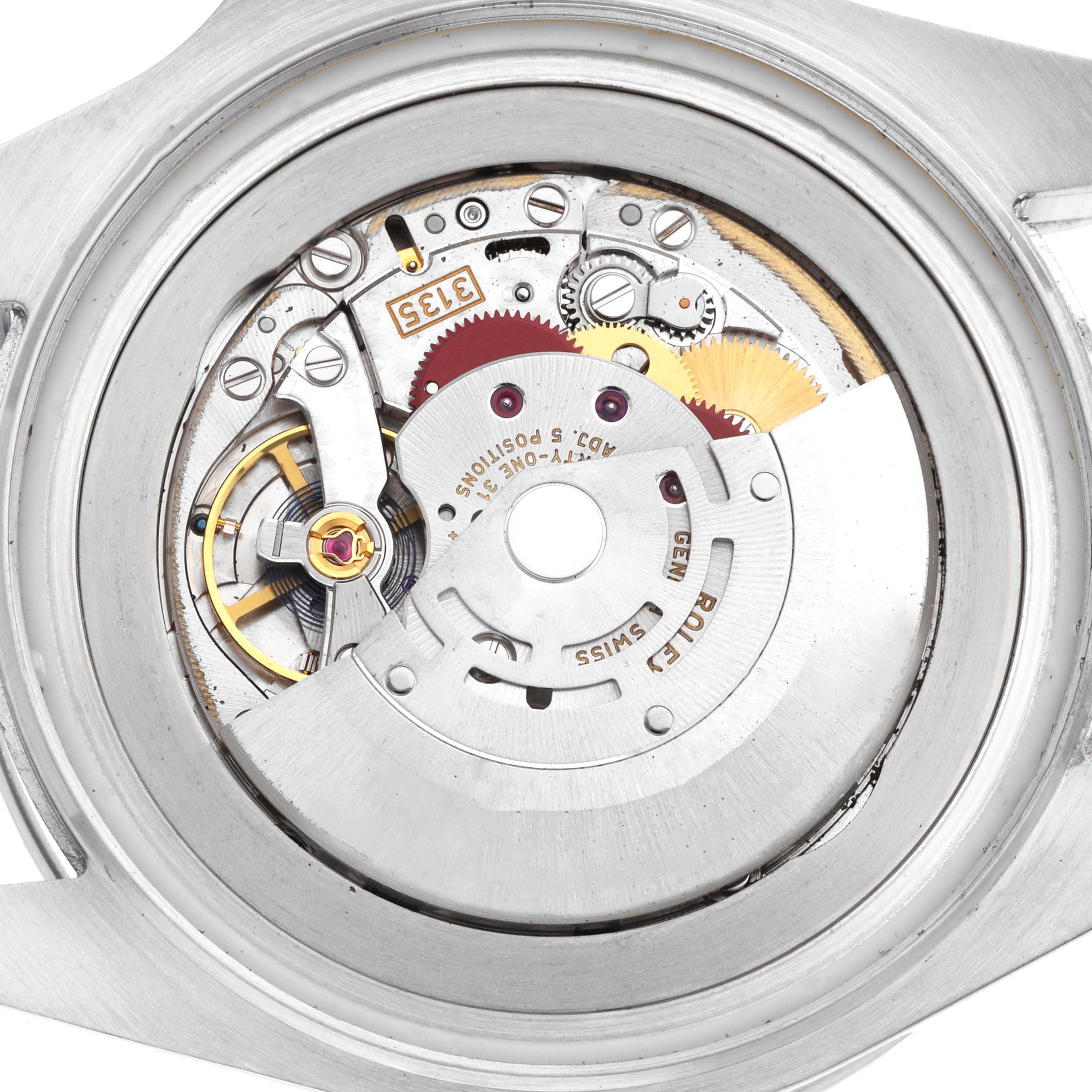 The image shows the movement of a Rolex Sea-Dweller 116660 Men
s Stainless Steel Black Dial watch, viewed from the back, highlighting its intricate mechanical components.