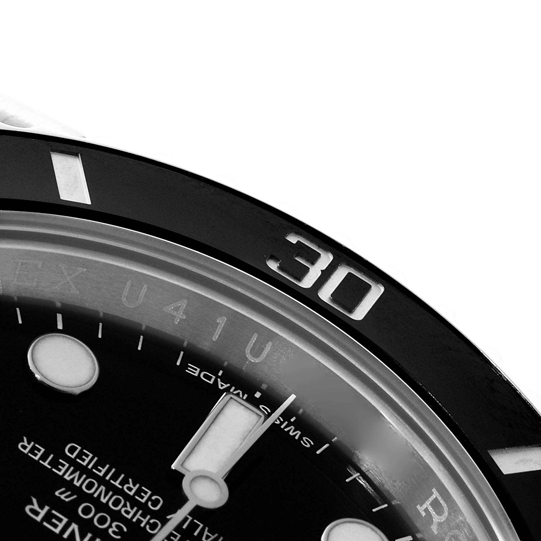 This close-up image shows part of the dial and bezel of a Rolex Submariner 116610 Men
s Stainless Steel Black Dial 116610 Men
s Stainless Steel Black Dial watch, including the 30-minute marker.