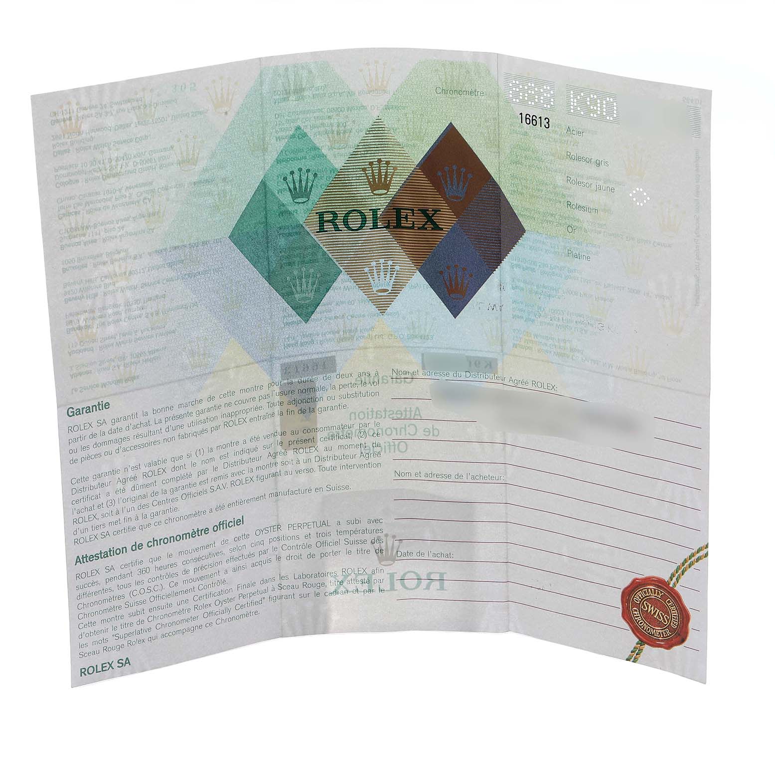 The image shows a folded Rolex Submariner 16613 Men
s Steel and Gold (two tone) Black Dial warranty or certificate document, displaying brand logos and text details.