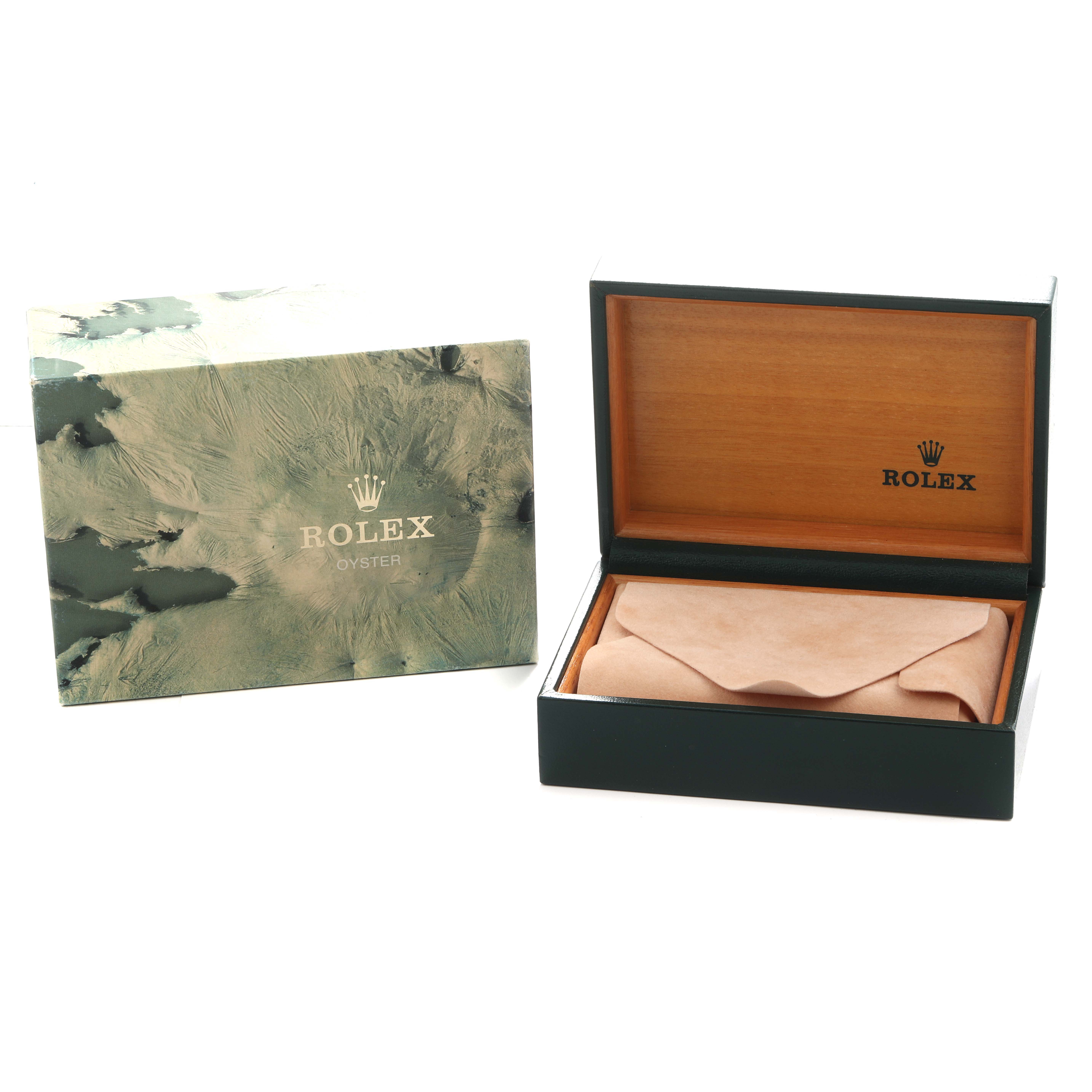 The image shows a Rolex Submariner 16613 Men
s Steel and Gold (two tone) Blue Dial watch box and sleeve from a front angle, with the box open and a brown interior pouch.