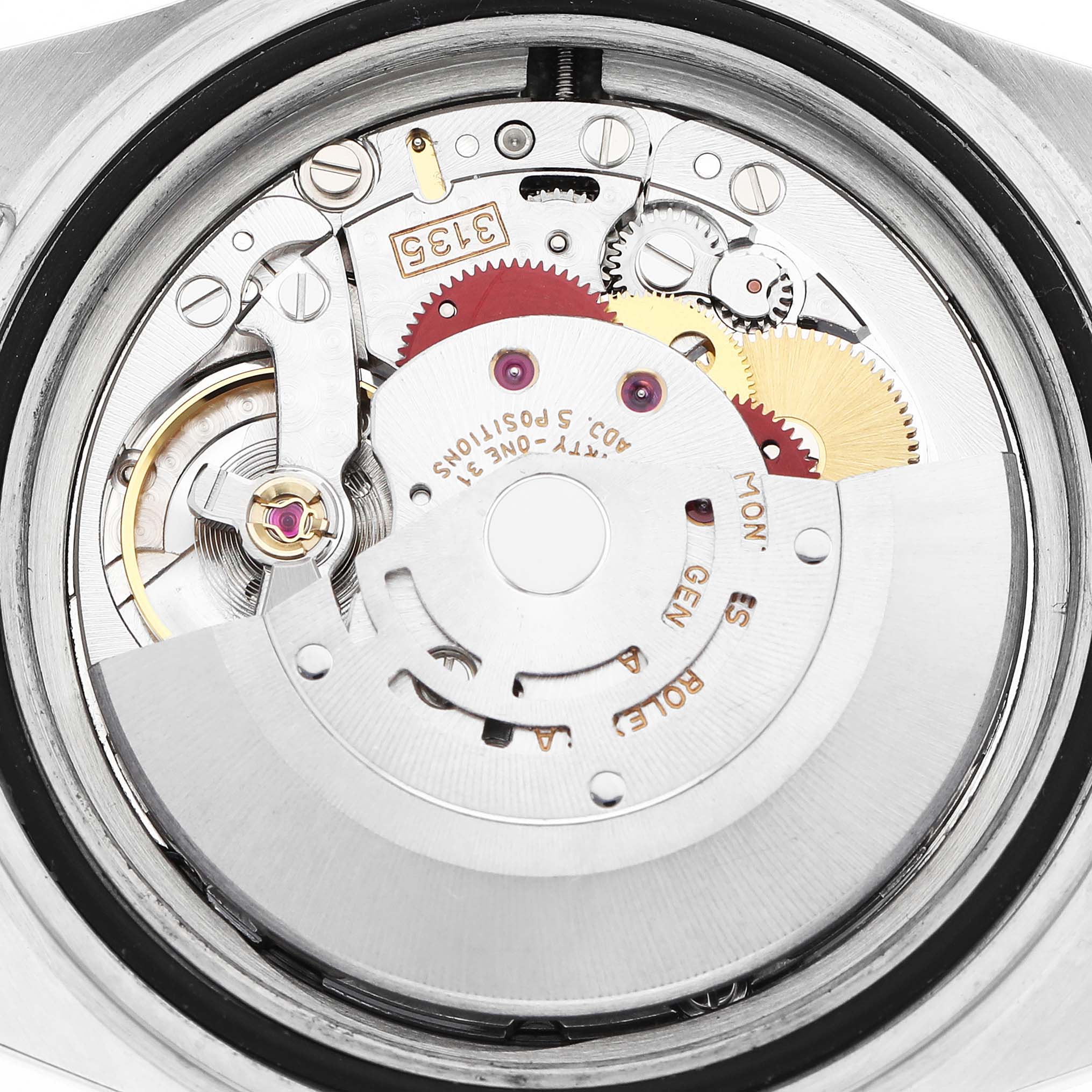 The image shows the internal movement components of a Rolex Submariner 16613 Men
s Steel and Gold (two tone) Blue Dial watch from a top-down angle.