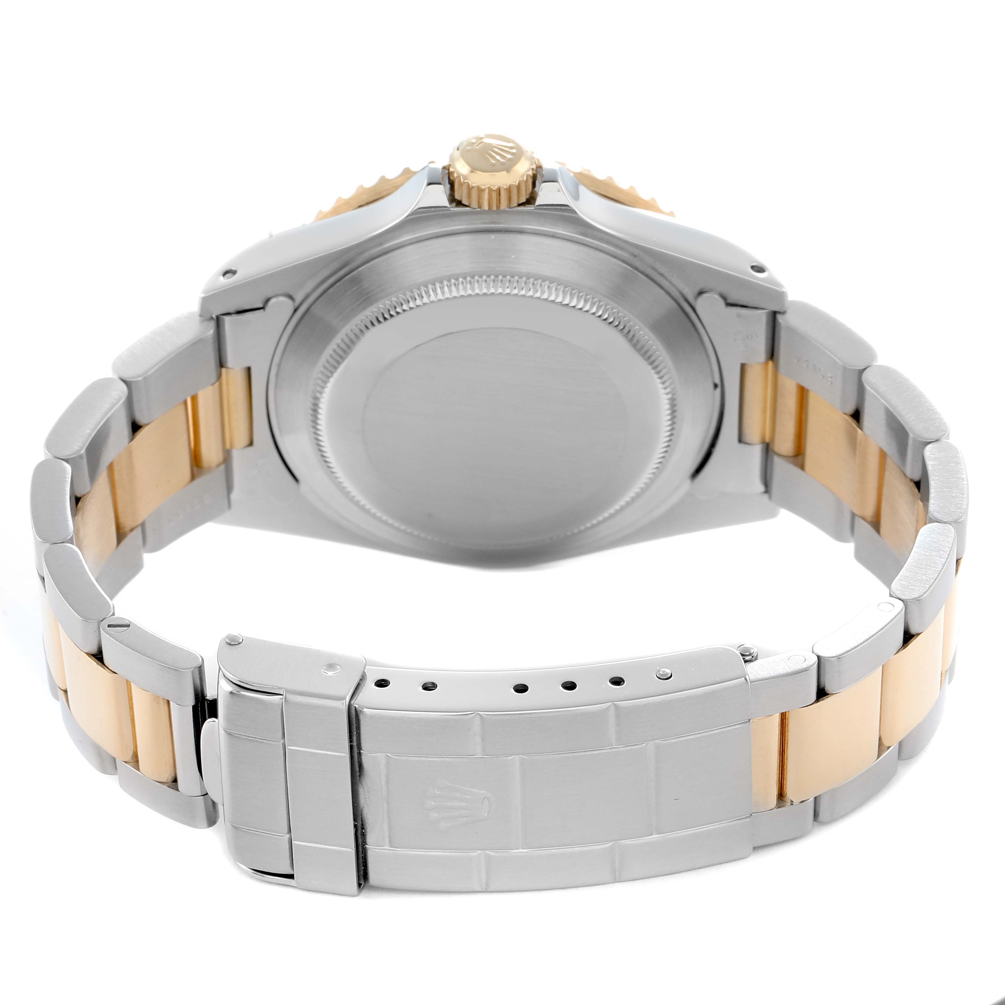 The image shows the back view of a Rolex Submariner 16613 Men
s Steel and Gold (two tone) Blue Dial, highlighting its case back, crown, and two-tone bracelet.