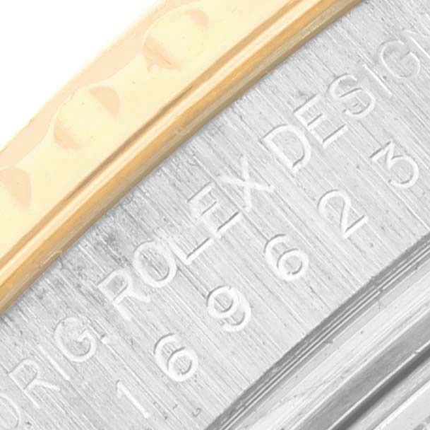 The image shows a close-up of the bezel and casing edge with engraved text on the Rolex Yacht-Master 169623 Women's Steel and Gold (two tone) Champagne Dial 169623 Women's Steel and Gold (two tone) Champagne Dial watch.