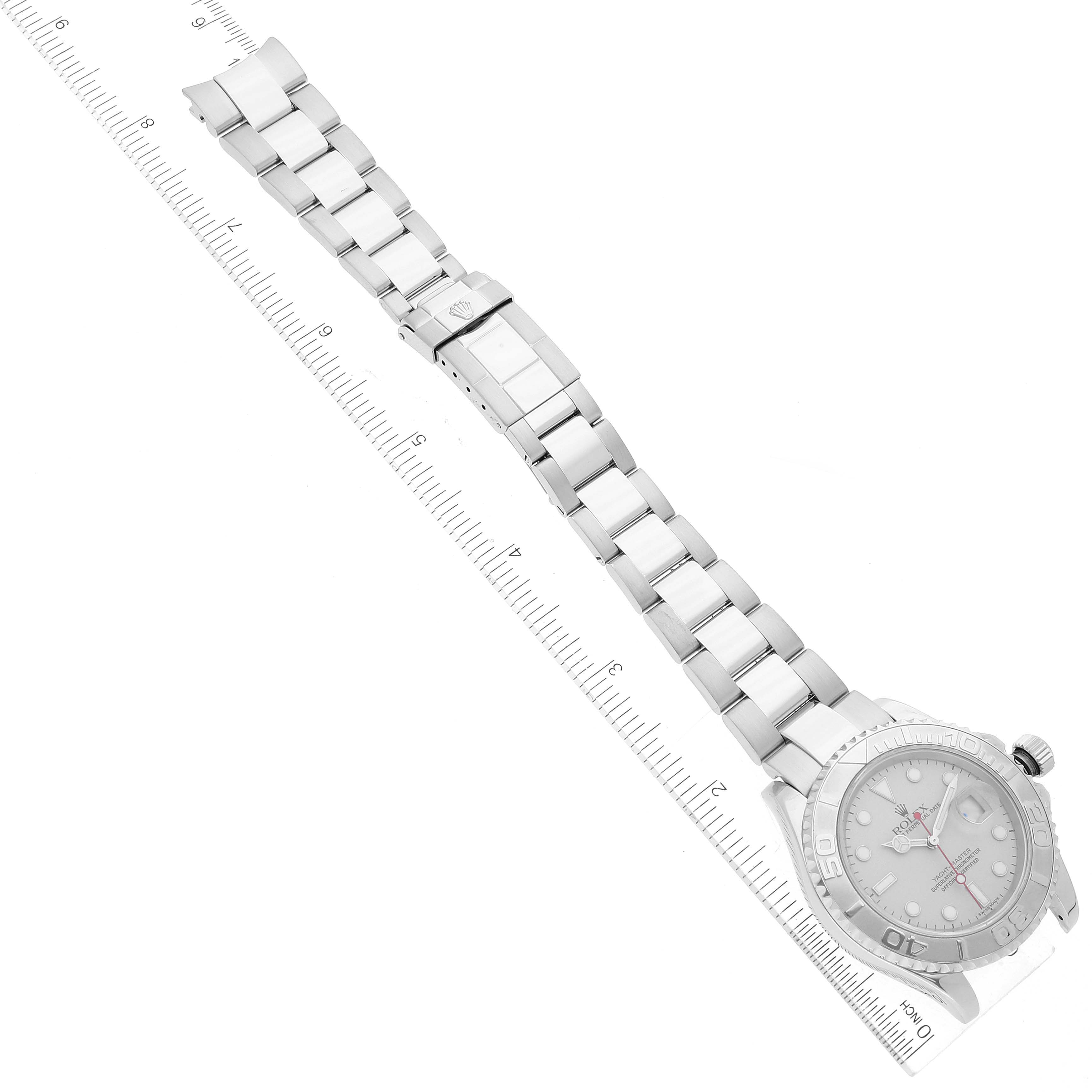 The image shows a Rolex Yacht-Master 16622 Men's Stainless Steel Silver Dial 16622 Men's Stainless Steel Silver Dial watch placed diagonally with its full bracelet and dial visible, alongside a measuring ruler.
